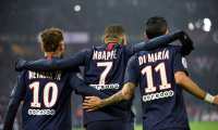 (FILES) In this file photo taken on December 04, 2019 Paris Saint-Germain's French forward Kylian Mbappe (C) is congratulated by Paris Saint-Germain's Brazilian forward Neymar (L) and Paris Saint-Germain's Argentine midfielder Angel Di Maria after scoring a goal during the French L1 football match between Paris Saint-Germain (PSG) and FC Nantes (FCN) at the Parc des Princes in Paris. - The football season in France has been declared over following a league vote on Thursday, with Paris Saint-Germain being named as champions. PSG topped the Ligue 1 table by 12 points from Marseille when the season was suspended in mid-March because of the coronavirus outbreak, which has gone on to kill more than 24,000 people in France. (Photo by Bertrand GUAY / AFP)