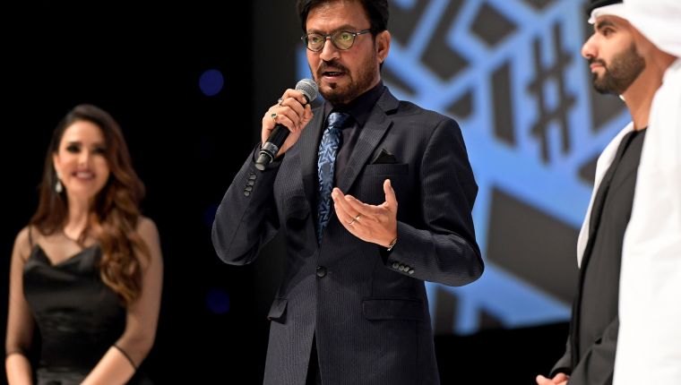 Dubai (United Arab Emirates).- (FILE) - Indian actor Irrfan Khan (C) speaks on the stage after receiving the Lifetime Achievement Award from Sheikh Mansour bin Mohammed al-Maktoum at the opening of the Dubai International Film Festival in Dubai, 06 December 2017 (reissude 29 April 2020). Media reports state on 29 April 2020 that Bollywood actor Irrfan Khan has died at the age of 53 in Mumbai, India. (Cine, Cine) EFE/EPA/MARTIN DOKOUPIL *** Local Caption *** 53940942