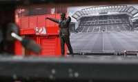 (FILES) In this file photo taken on April 18, 2020 a picture shows the statue of Liverpool football club's late legendary manager Bill Shankly at Liverpool football club's stadium Anfield in Liverpool, northwest England. - Premier League clubs will meet on May 1, 2020, to discuss whether it is realistic to complete the season as Manchester City striker Sergio Aguero admitted players are scared at being rushed back into action. (Photo by Paul ELLIS / AFP)