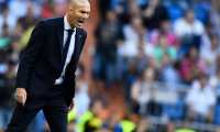 (FILES) In this file photo taken on October 01, 2019 Real Madrid's French coach Zinedine Zidane shouts intructions to his players during the UEFA Champions league Group A football match between Real Madrid and Club Brugge at the Santiago Bernabeu stadium in Madrid on October 1, 2019. - Two points separate Spain's greatest rivals FC Barcelona and Real Madrid CF ahead of the return to top-flight games on June 11, 2020, when the derby between Sevilla and Real Betis will end a 93-day hiatus and launch a five-week sprint to the finish. (Photo by OSCAR DEL POZO / AFP)