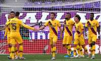 Barcelona players celebrate their goal, scored by Barcelona's Chilean midfielder Arturo Vidal (4R) during the Spanish league football match between Real Valladolid FC and FC Barcelona at the Jose Zorrilla stadium in Valladolid on July 11, 2020. (Photo by CESAR MANSO / AFP)