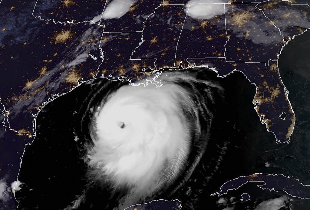 This RAMMB/NOAA satellite image shows Hurricane Laura moving Northwestern in the Gulf of Mexico towards Louisiana at 11:40 UTC on August 26, 2020. - Texas and Louisiana residents evacuated flood zones and boarded up windows August 25, 2020 as Hurricane Laura barreled towards the coastline, after earlier causing 25 deaths in the Caribbean. The storm's maximum sustained winds were nearing 90 mph (150 km/h), with gusts higher, the US National Hurricane Center (NHC) reported, and forecasters expect it to strengthen significantly in the next 24 hours. "Laura is expected to be a major hurricane at landfall," the center said. (Photo by Handout / RAMMB/NOAA/NESDIS / AFP) / RESTRICTED TO EDITORIAL USE - MANDATORY CREDIT "AFP PHOTO / RAMMB/NOAA" - NO MARKETING - NO ADVERTISING CAMPAIGNS - DISTRIBUTED AS A SERVICE TO CLIENTS