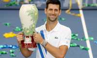 NEW YORK, NEW YORK - AUGUST 29: Novak Djokovic of Serbia poses with the winner's trophy after defeating Milos Raonic of Canada in the men's singles final of the Western & Southern Open at the USTA Billie Jean King National Tennis Center on August 29, 2020 in the Queens borough of New York City.   Matthew Stockman/Getty Images/AFP
== FOR NEWSPAPERS, INTERNET, TELCOS & TELEVISION USE ONLY ==