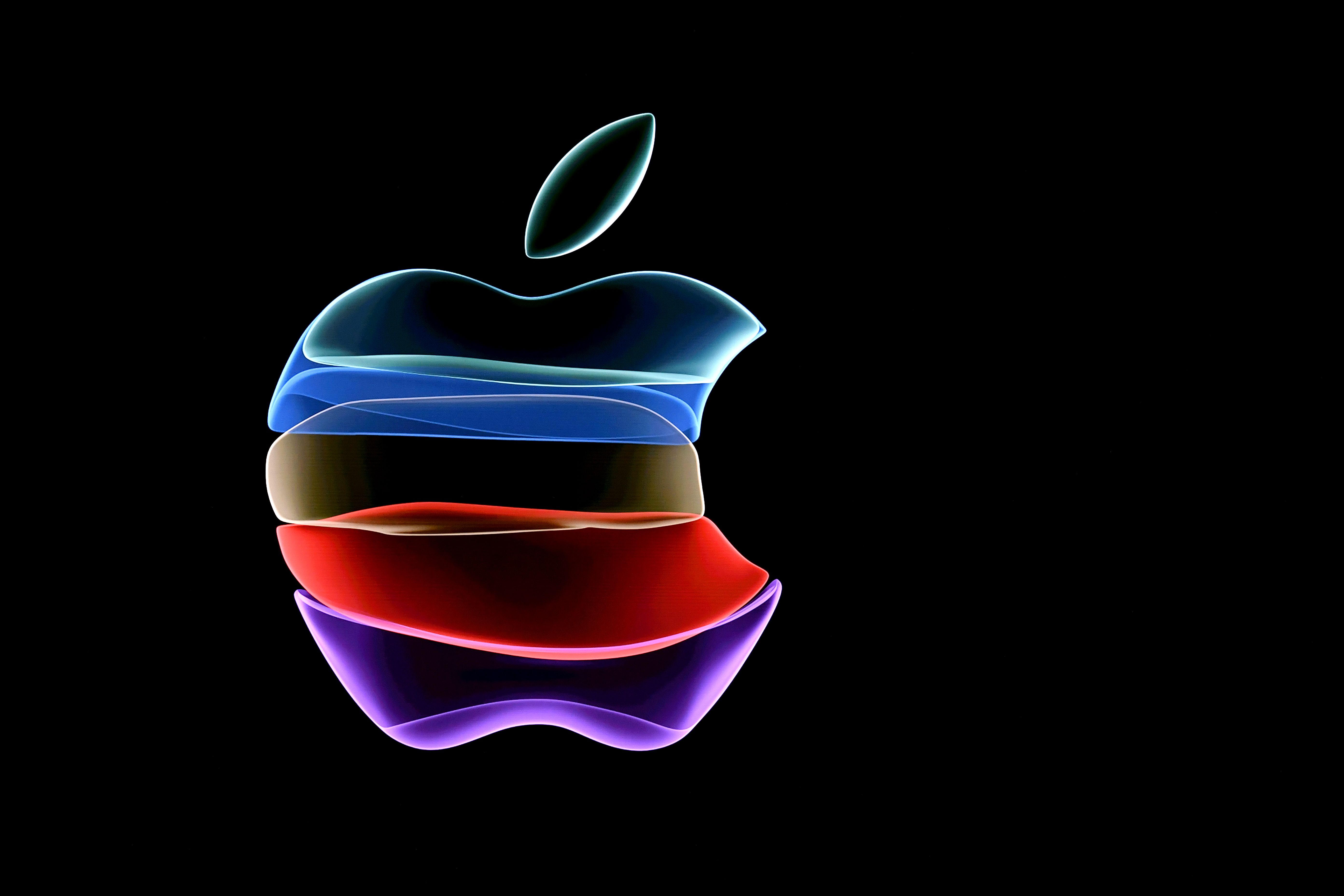 (FILES) In this file photo the apple logo is projected on a screen before the start of a product launch event at Apple's headquarters in Cupertino, California, on September 10, 2019. - Apple on September 8, 2020 fired off invitations to a September 15 online event expected to introduce a new-generation iPhone tailored for superfast 5G telecom networks. The typically tight-lipped technology titan revealed only that the presentation would be streamed starting at 1700 GMT from its headquarters in Silicon Valley. (Photo by Josh Edelson / AFP)