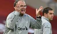 Leeds United's Argentinian head coach Marcelo Bielsa gestures on the touchline during the English Premier League football match between Liverpool and Leeds United at Anfield in Liverpool, north west England on September 12, 2020. (Photo by Shaun Botterill / POOL / AFP) / RESTRICTED TO EDITORIAL USE. No use with unauthorized audio, video, data, fixture lists, club/league logos or 'live' services. Online in-match use limited to 120 images. An additional 40 images may be used in extra time. No video emulation. Social media in-match use limited to 120 images. An additional 40 images may be used in extra time. No use in betting publications, games or single club/league/player publications. /