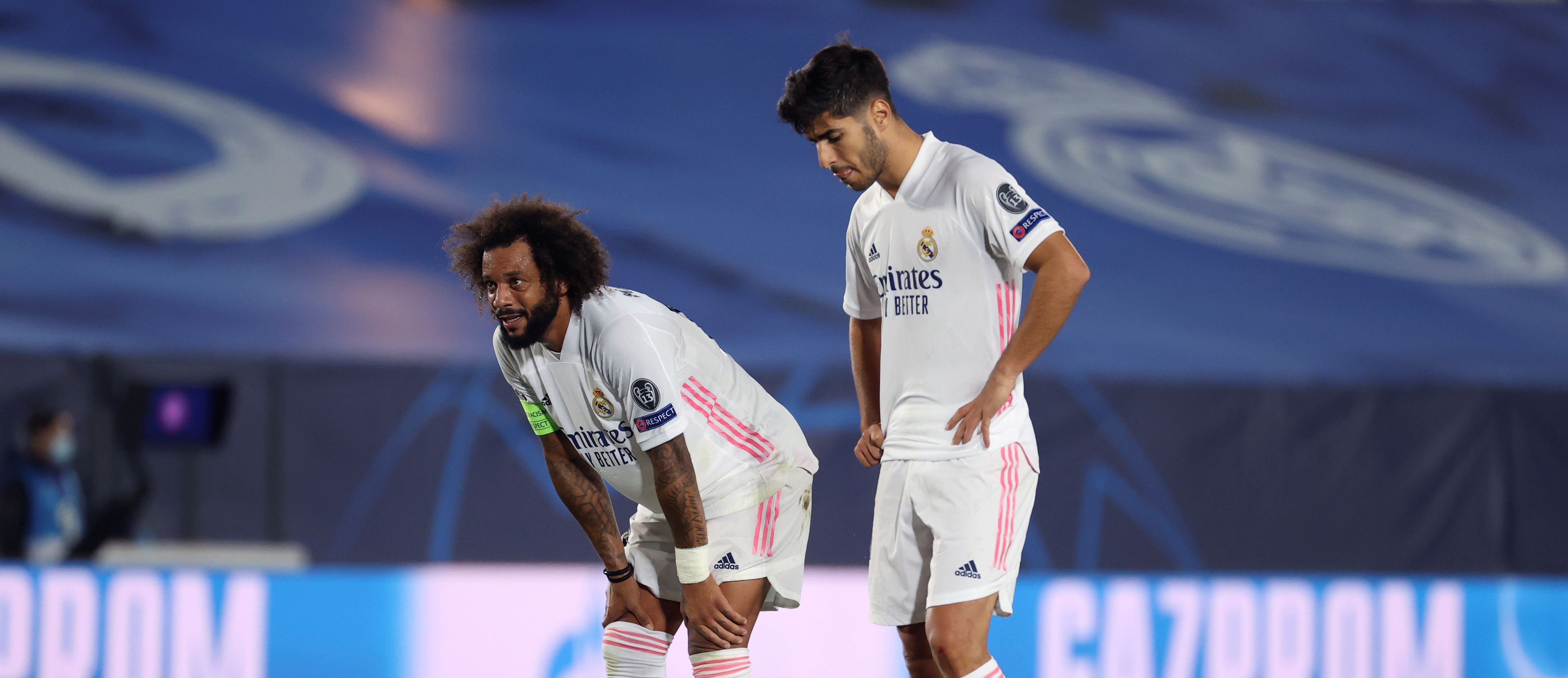 Los jugadores del Real Madrid, Marcelo Vieira (i) y Marco Asensio durante el partido ante el Shakhtar. (Foto Prensa Libre: EFE)