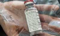 (FILES) In this file photo taken on April 8, 2020 one vial of the drug Remdesivir is seen during a press conference about the start of a study with the Ebola drug Remdesivir in particularly severely ill patients at the University Hospital Eppendorf (UKE) in Hamburg, northern Germany, amidst the new coronavirus COVID-19 pandemic. - The US Food and Drug Administration on October 22, 2020 granted full approval to the antiviral drug Remdesivir as a treatment for patients hospitalized with Covid-19, its manufacturer Gilead said, following conditional authorization granted in May. (Photo by Ulrich Perrey / POOL / AFP)