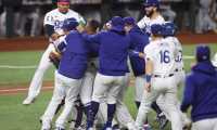 (FILES) In this file photo the Los Angeles Dodgers celebrate after defeating the Tampa Bay Rays in Game Six to win the 2020 MLB World Series at Globe Life Field on October 27, 2020 in Arlington, Texas. - The Los Angeles Dodgers ended their 32-year wait for a World Series title on October 27, 2020, beating the Tampa Bay Rays 3-1 to claim the Major League Baseball crown at last after a string of agonizing near-misses.Corey Seager drove in the go-ahead run, Mookie Betts homered late and a stream of Los Angeles pitchers stood firm as the Dodgers won the seventh World Series in club history but their first since 1988. (Photo by TOM PENNINGTON / GETTY IMAGES NORTH AMERICA / AFP)
