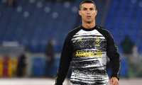 (FILES) In this file photo taken on September 27, 2020 Juventus' Portuguese forward Cristiano Ronaldo warms up prior to the Italian Serie A football match Roma vs Juventus at the Olympic stadium in Rome. - Portuguese star Cristiano Ronaldo has been left off Juventus' team for October 28 Champions League clash against Barcelona in Turin, two weeks after testing positive for coronavirus. The 35-year-old, the top scorer in the history of the competition with 130 goals, needed to test negative 24 hours before the game against his great rival Lionel Messi's Spanish team. (Photo by Tiziana FABI / AFP)