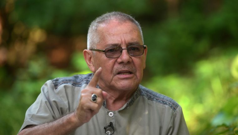 Former guerrilla commander Cesar Montes gestures during an interview with AFP at an undisclosed location in Central America on September 12, 2019. - Montes, who is wanted by Guatemala's authorities, denied being linked to the execution of three soldiers by alleged drug traffickers occurred in northern Guatemala on September 3. (Photo by STRINGER / AFP)