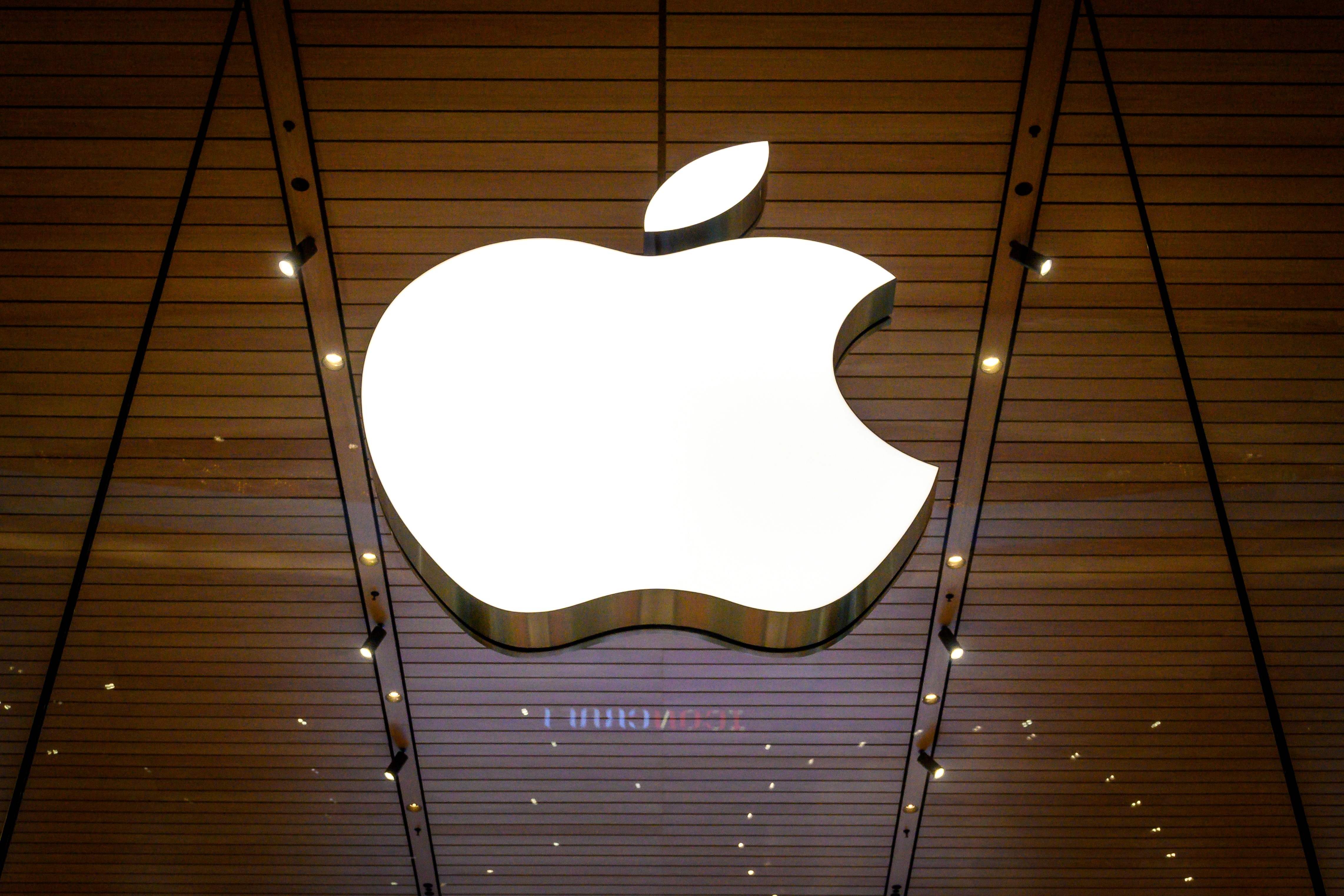 The Apple logo is seen at a company store in an upscale shopping mall in Bangkok on November 10, 2020. (Photo by Mladen ANTONOV / AFP)