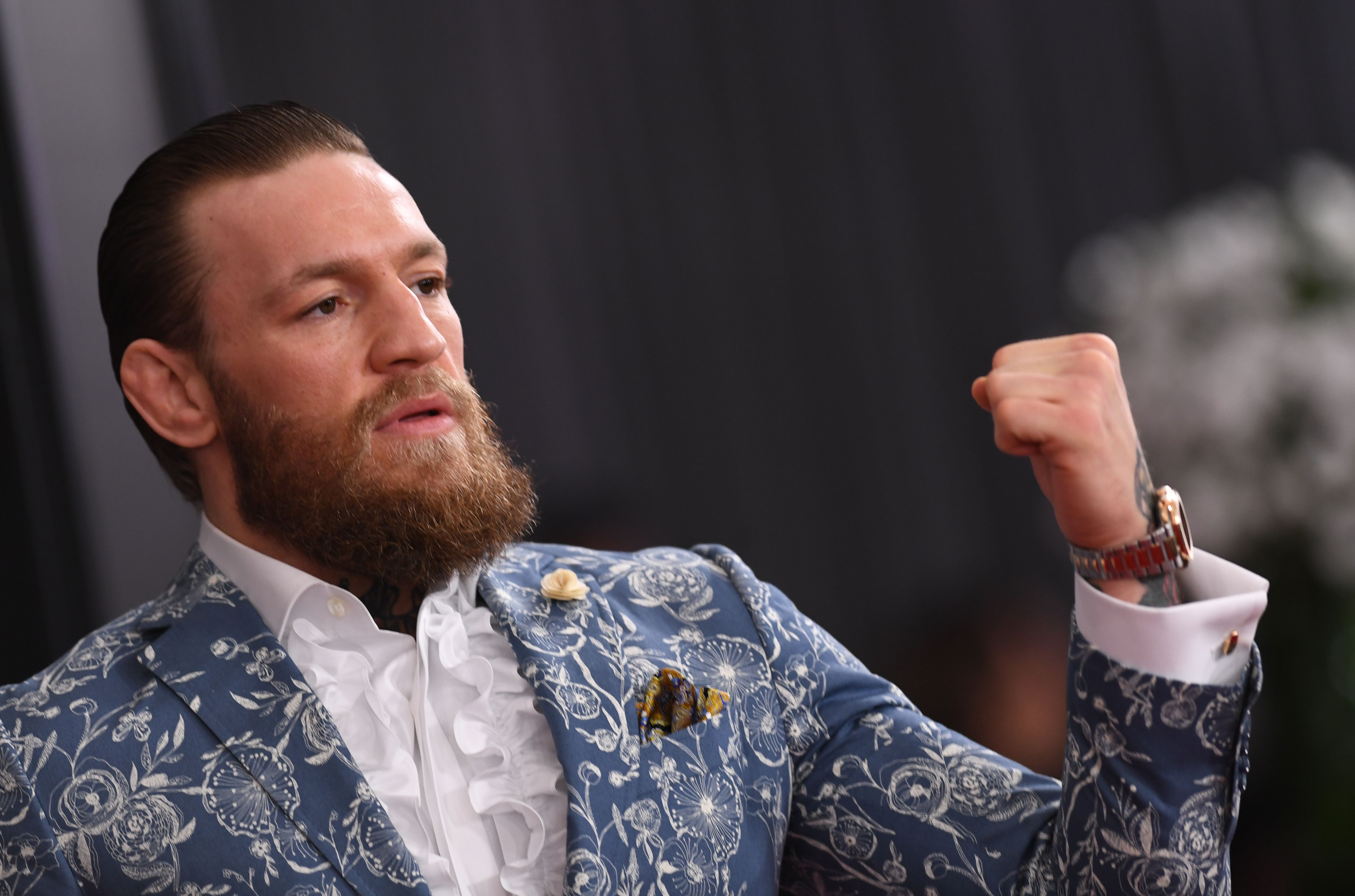 (FILES) In this file photo taken on January 26, 2020 Irish mixed martial arts artist Conor McGregor arrives for the 62nd Annual Grammy Awards in Los Angeles. - Conor McGregor is set to reverse his latest flirtation with retirement with a fight against Dustin Poirier in January, the Irish mixed martial arts star said November 19. A statement on McGregor's news website, TheMacLife.com, said the 155-pound contest would take place on January 23, with Abu Dhabi in the United Arab Emirates the likely venue. (Photo by VALERIE MACON / AFP)