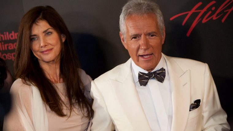 (FILES) In this file photo Alex Trebek (R) and wife Jean Currivan Trebek arrive at the 38th Annual Daytime Emmy Awards show in Las Vegas, Nevada, on June 19, 2011. - The longtime Jeopardy! TV host Alex Trebek has died on November 8, 2020, after a battle with Stage 4 pancreatic cancer since announcing the news back in March 2019. He was 80 years old. (Photo by ADRIAN SANCHEZ-GONZALEZ / AFP)