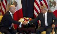 (FILES) In this file picture taken on March 5, 2012 then US Vice-President Joe Biden (L) shakes hands with then Mexican presidential candidate for Democratic Revolution Party (PRD) Andres Manuel Lopez Obrador (R), during a meeting in Mexico City. - Mexican President Andres Manuel Lopez Obrador said on December 21, 2020 he expects US President-elect Joe Biden to help stem the wave of migration from Central America through investment. (Photo by Yuri CORTEZ / AFP)