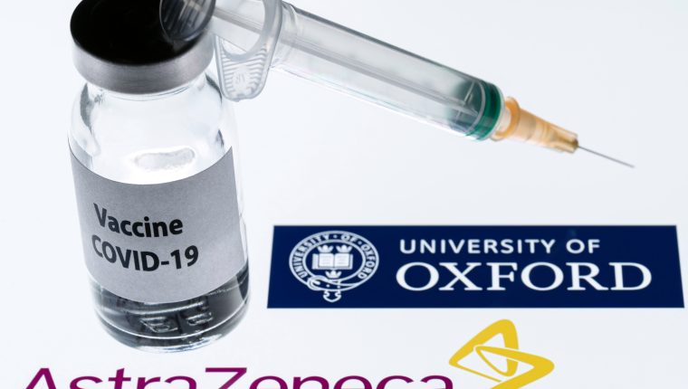 (FILES) This file illustration picture taken in Paris on November 23, 2020 shows a syringe and a bottle reading "Covid-19 Vaccine" next to AstraZeneca company and University of Oxford logos. - The Covid-19 vaccine developed by the British drugs group AstraZeneca and the University of Oxford has achieved a "winning formula" for efficacy, the company's chief executive said on Sunday, December 27. (Photo by JOEL SAGET / AFP)