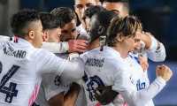 Real Madrid's French defender Ferland Mendy (C-R) celebrates with teammates after opening the scoring during the UEFA Champions League round of 16 first leg football match Atalanta vs Real Madrid on February 24, 2021 at the Atleti Azzurri d'Italia stadium in Bergamo. (Photo by Tiziana FABI / AFP)