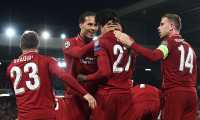 (FILES) In this file photo taken on May 7, 2019, Liverpool's Belgium striker Divock Origi (2R) celebrates with Liverpool's Dutch defender Virgil van Dijk after scoring their fourth and winning goal during the UEFA Champions league semi-final second leg football match between Liverpool and Barcelona at Anfield in Liverpool, north west England. (Photo by Paul ELLIS / AFP)