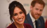 (FILES) In this file photo taken on October 25, 2019 Britain's Prince Harry, Duke of Sussex (R) and Meghan, Duchess of Sussex attend a roundtable discussion on gender equality with The Queens Commonwealth Trust (QCT) and One Young World at Windsor Castle in Windsor. - Queen Elizabeth II is saddened by the challenges faced by her grandson Prince Harry and his wife Meghan, and takes their allegations of racism in the royal family seriously, Buckingham Palace said on March 9, 2021. "The whole family is saddened to learn the full extent of how challenging the last few years have been for Harry and Meghan. The issues raised, particularly that of race, are concerning," the palace said in a statement released on the queen's behalf. (Photo by Jeremy Selwyn / POOL / AFP)