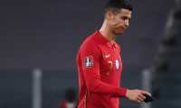 Portugal's forward Cristiano Ronaldo leaves the pitch at the end of the FIFA World Cup Qatar 2022 qualification football match between Portugal and Azerbaijan on March 24, 2021 at the Juventus Stadium. (Photo by Marco BERTORELLO / AFP)