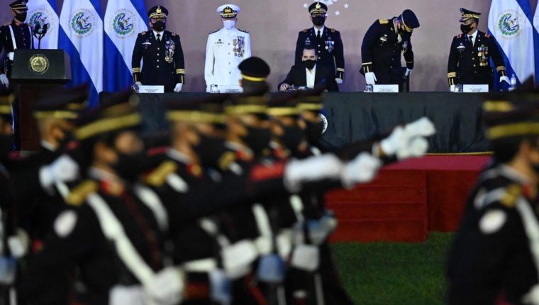 Salvadoran President Nayib Bukele (C) participate in the commemoration of the Day of the Salvadoran Soldier and the 197th anniversary of the Salvadoran Armed Forces next to Salvadoran Defence Minister Rene Merino Monroy (3-L) and other top military men, at the Captain General Gerardo Barrios Military School, in Antiguo Cuscatlan, El Salvador, on May 7, 2021. (Photo by MARVIN RECINOS / AFP)