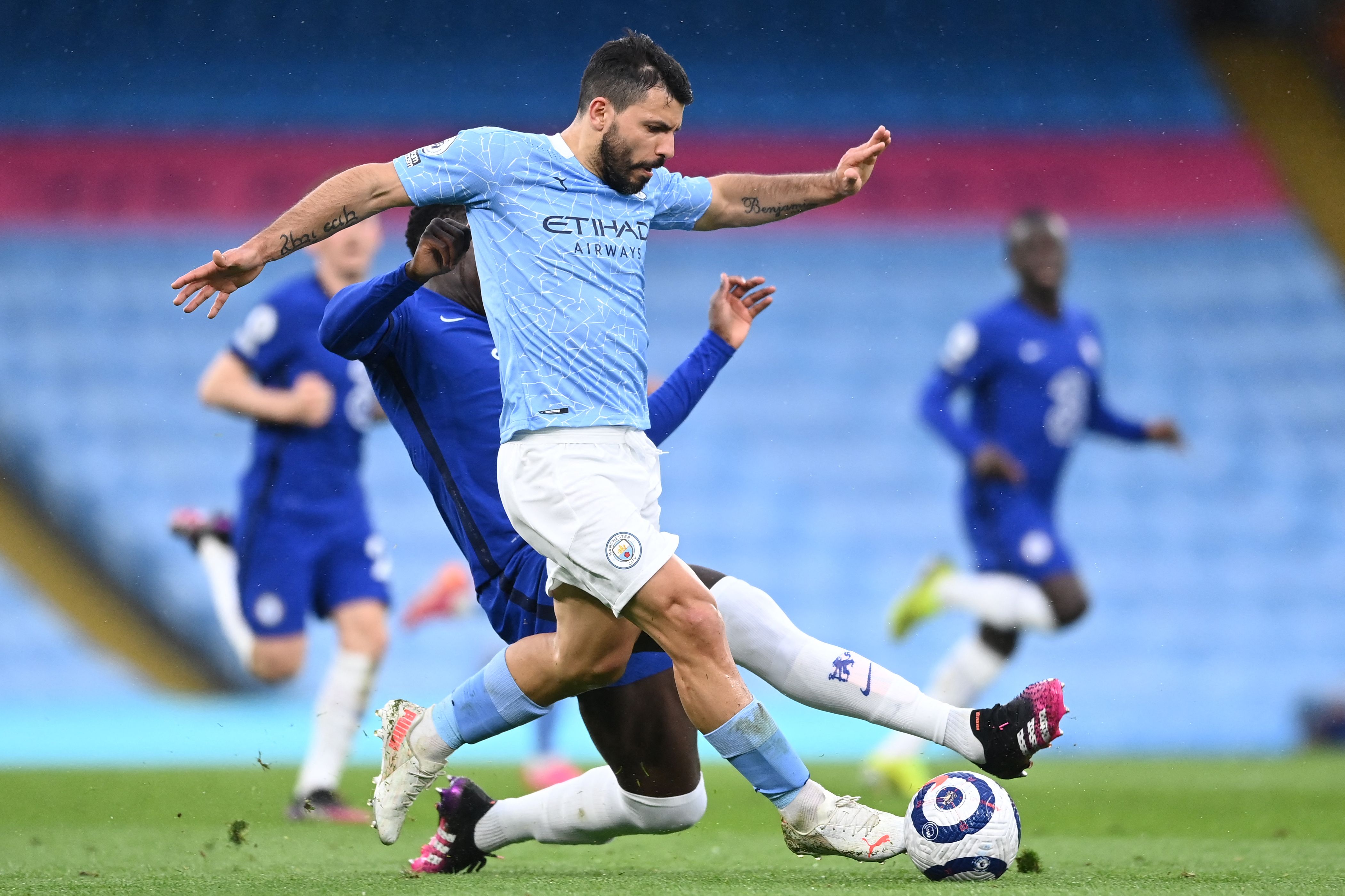 Manchester City's Argentinian striker Sergio Aguero is tackled by Chelsea's French defender Kurt Zouma during the English Premier League football match between Manchester City and Chelsea at the Etihad Stadium in Manchester, north west England, on May 8, 2021. (Photo by Laurence Griffiths / POOL / AFP) / RESTRICTED TO EDITORIAL USE. No use with unauthorized audio, video, data, fixture lists, club/league logos or 'live' services. Online in-match use limited to 120 images. An additional 40 images may be used in extra time. No video emulation. Social media in-match use limited to 120 images. An additional 40 images may be used in extra time. No use in betting publications, games or single club/league/player publications. /