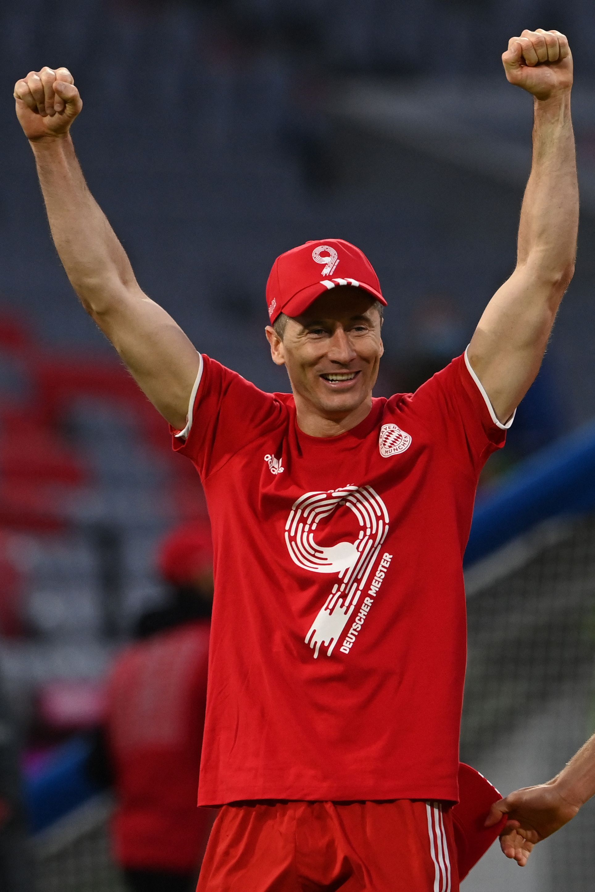 Bayern Munich's Polish forward Robert Lewandowski celebrates after the German first division Bundesliga football match FC Bayern Munich v Borussia Moenchengladbach in Munich, southern Germany on May 8, 2021. - Bayern Munich won the Bundesliga for the ninth time in a row after Leipzig lost to Dortmond earlier in the day. (Photo by CHRISTOF STACHE / POOL / AFP) / DFL REGULATIONS PROHIBIT ANY USE OF PHOTOGRAPHS AS IMAGE SEQUENCES AND/OR QUASI-VIDEO