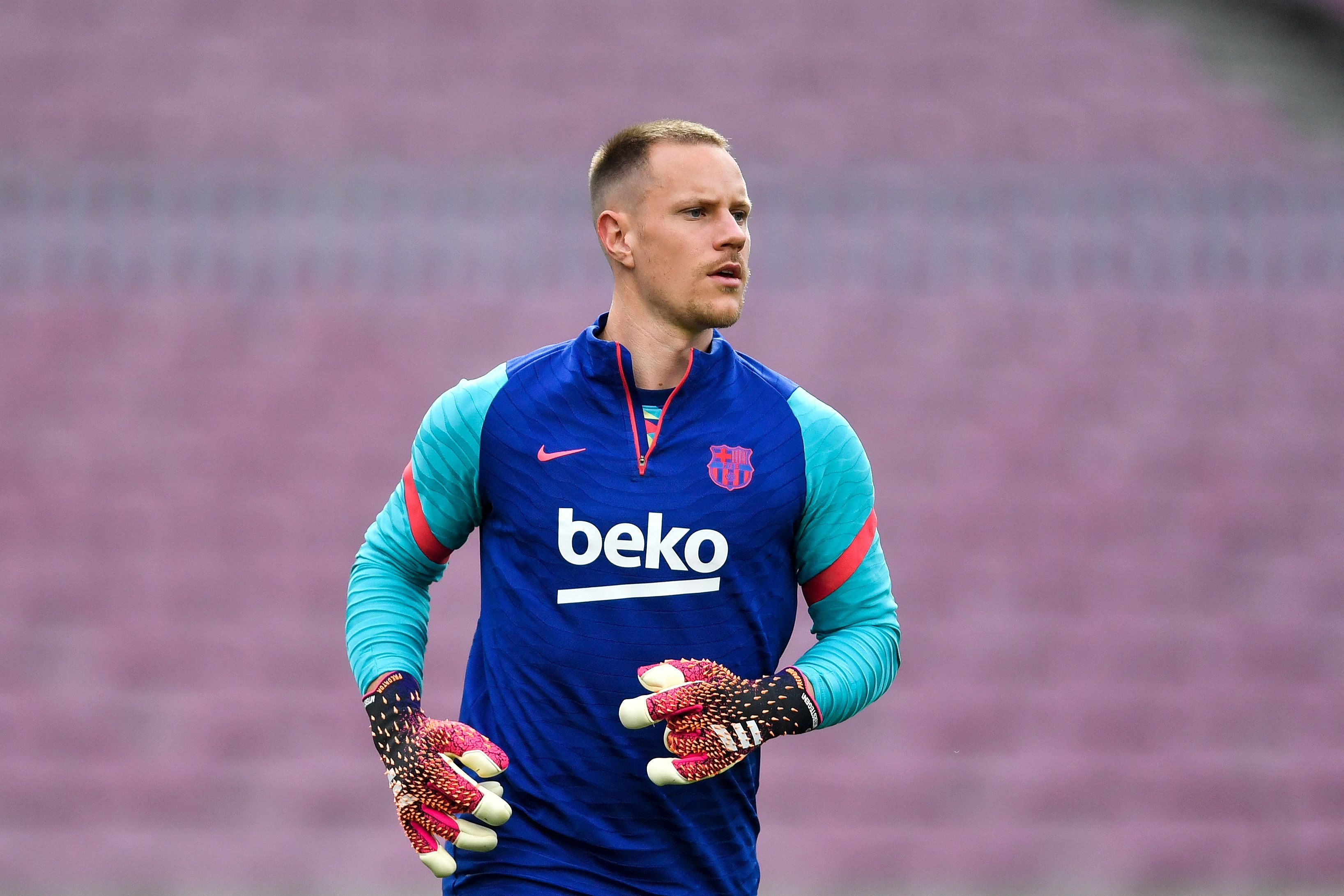 Barcelona's German goalkeeper Marc-Andre ter Stegen warms up before the Spanish League football match between FC Barcelona ans RC Celta de Vigo at the Camp Nou stadium in Barcelona on May 16, 2021. (Photo by Pau BARRENA / AFP)