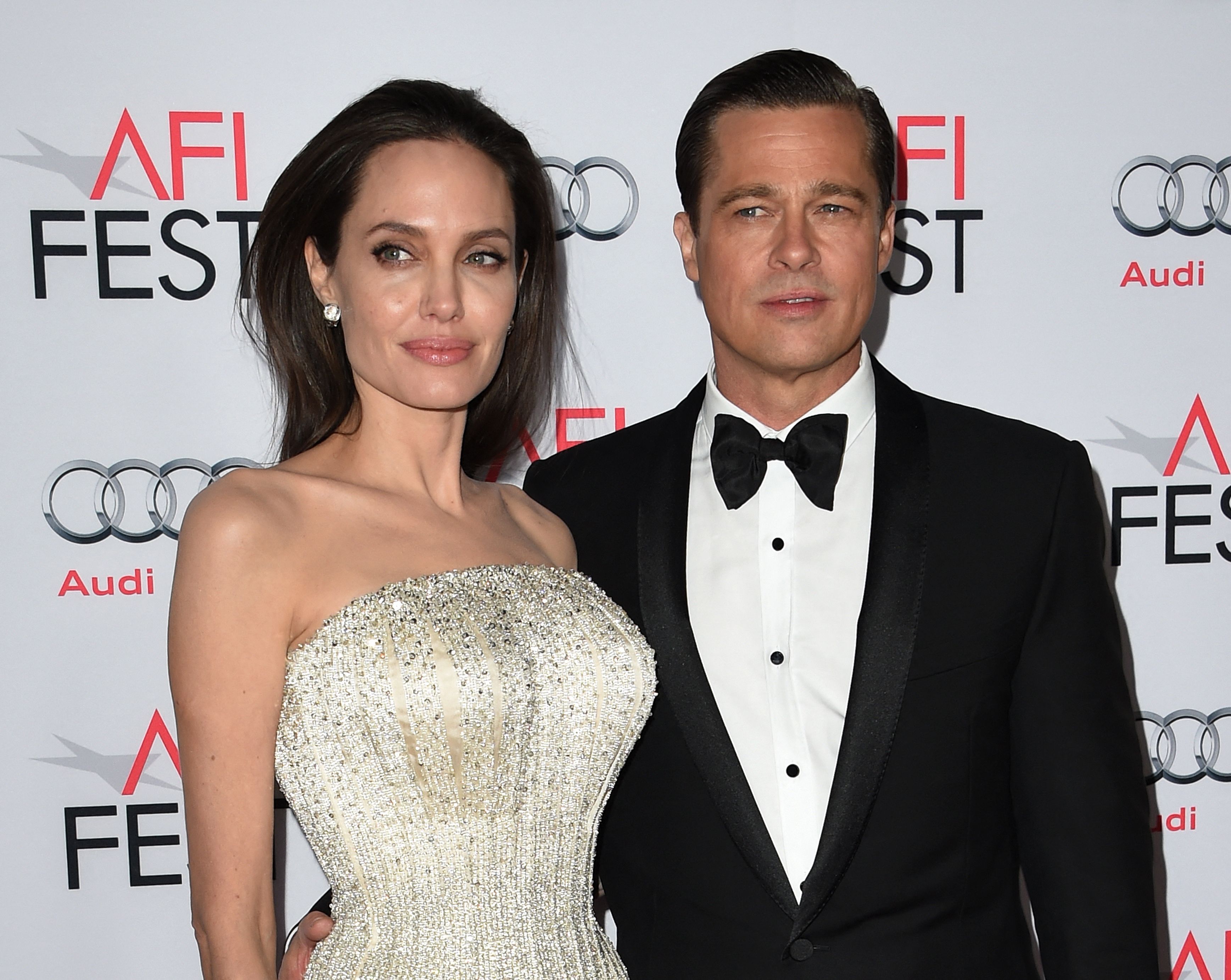 (FILES) In this file photo taken on November 5, 2015 Writer-director-producer-actress Angelina Jolie Pitt (L) and actor-producer Brad Pitt arrive for the opening night gala premiere of Universal Pictures' 'By the Sea' during AFI FEST 2015 presented by Audi at the TCL Chinese Theatre in Hollywood. - A California judge ruled that a custody order concerning Brad Pitt and Angelina Jolie's children must be modified in his favor, according to court documents filed by the 
