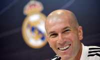 (FILES) In this file photo taken on March 15, 2019 Real Madrid's French coach Zinedine Zidane smiles during a press conference at the Valdebebas training facilities in Madrid. - According to media reports, Zinedine Zidane has resigned as Real Madrid manager with immediate effect, just days after the club were beaten to the La Liga title by Atletico Madrid. The Frenchman's reported departure comes at the end of a disappointing campaign for the 13-time European champions, who also lost to Chelsea in the Champions League semi-finals as they failed to win a trophy for the first time in 11 seasons. (Photo by GABRIEL BOUYS / AFP)