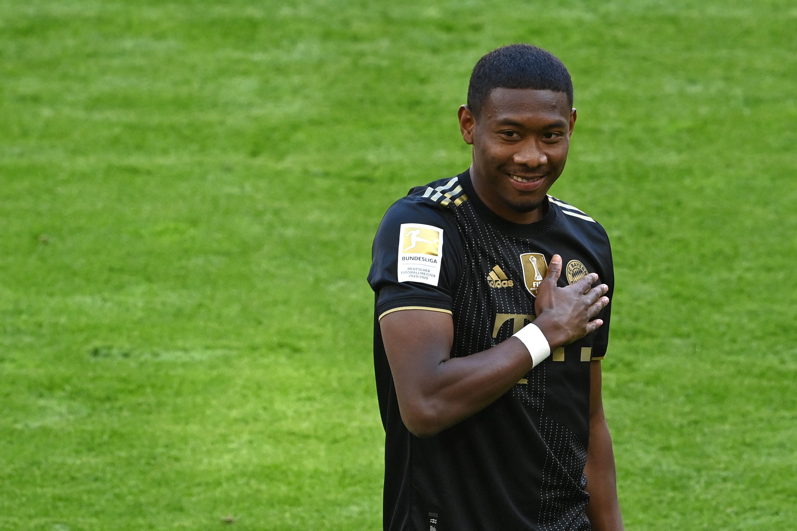 Bayern Munich's Austrian defender David Alaba gestures prior the German first division Bundesliga football match Bayern Munich vs FC Augsburg in Munich, southern Germany, on May 22, 2021. (Photo by CHRISTOF STACHE / POOL / AFP) / DFL REGULATIONS PROHIBIT ANY USE OF PHOTOGRAPHS AS IMAGE SEQUENCES AND/OR QUASI-VIDEO