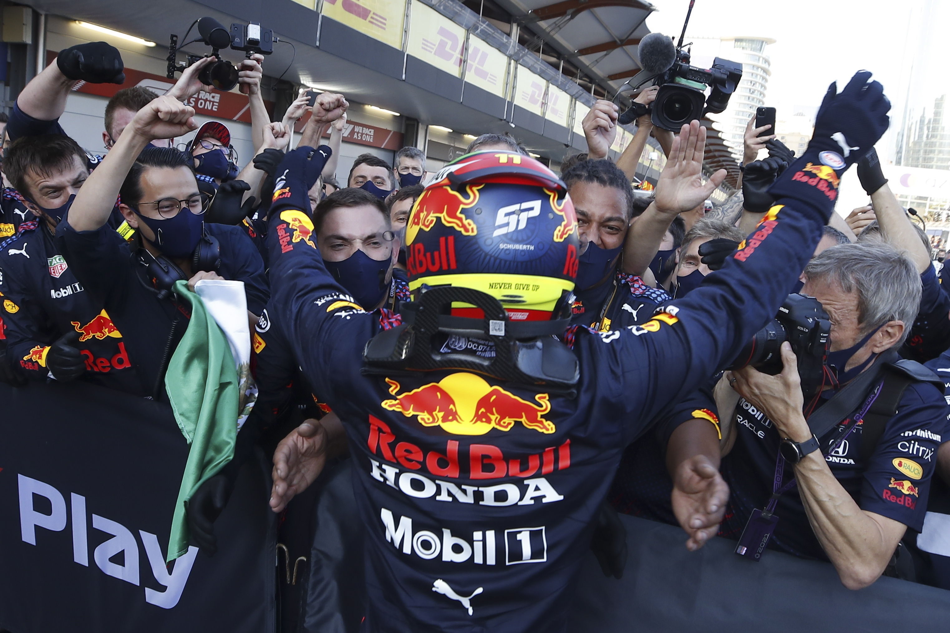 Baku (Azerbaijan), 06/06/2021.- Winner Mexican Formula One driver Sergio Perez of Red Bull Racing celebrates with team members after the Formula One Grand Prix of Azerbaijan at the Baku City Circuit in Baku, Azerbaijan, 06 June 2021. (Fórmula Uno, Azerbaiyán) EFE/EPA/Maxim Shemetov / POOL