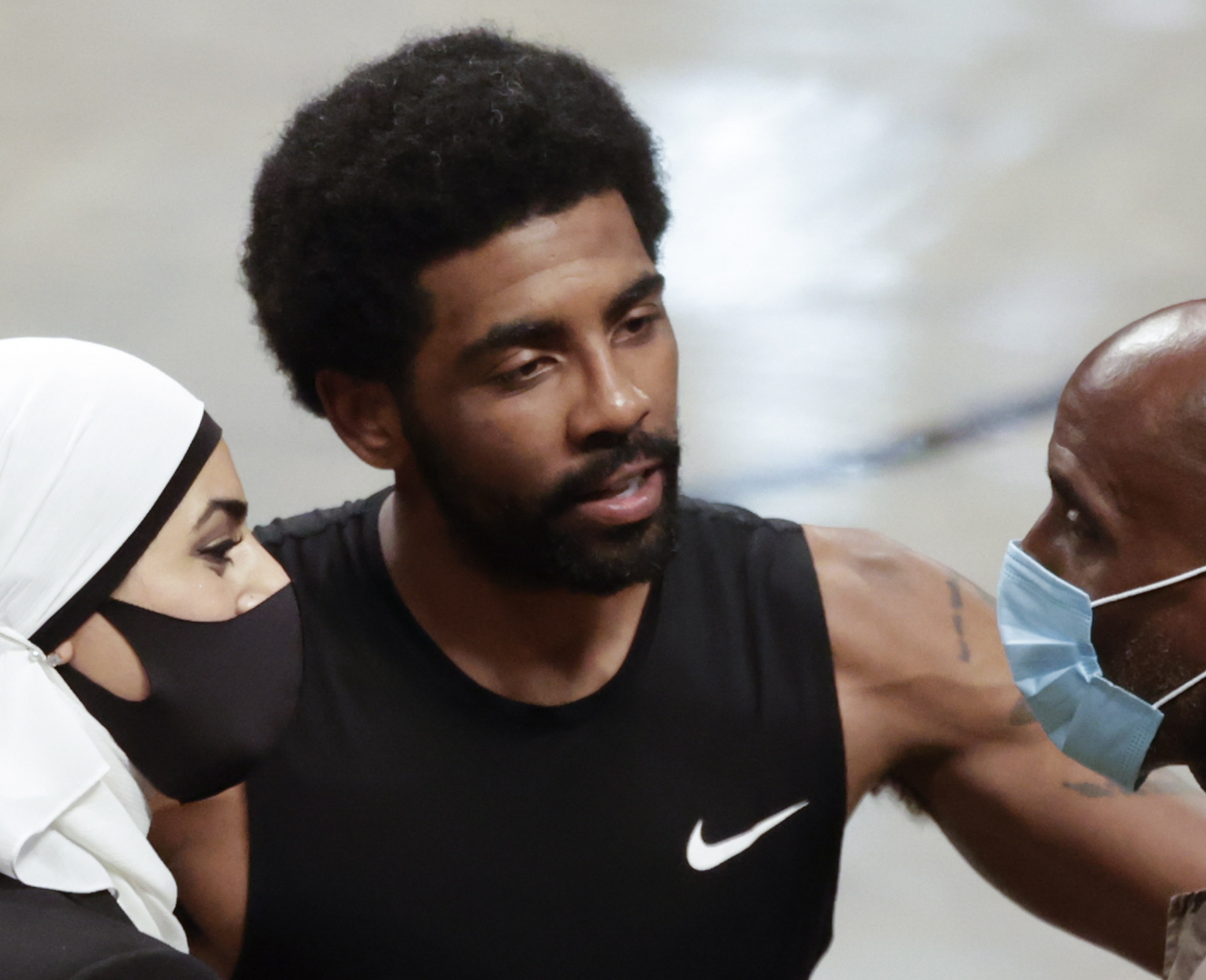 New York (United States), 08/06/2021.- Brooklyn Nets guard Kyrie Irving (R) talks to Manhattan district attorney candidate Tahanie Aboushi (L) and his father Drederick Irving after his teams win against the Milwaukee Bucks during game two of the 2021 NBA Eastern Conference Semi-Finals basketball playoff series between the Milwaukee Bucks and the Brooklyn Nets at the Barclays Center in Brooklyn, New York, USA, 07 June 2021. (Baloncesto, Estados Unidos, Nueva York) EFE/EPA/JASON SZENES SHUTTERSTOCK OUT