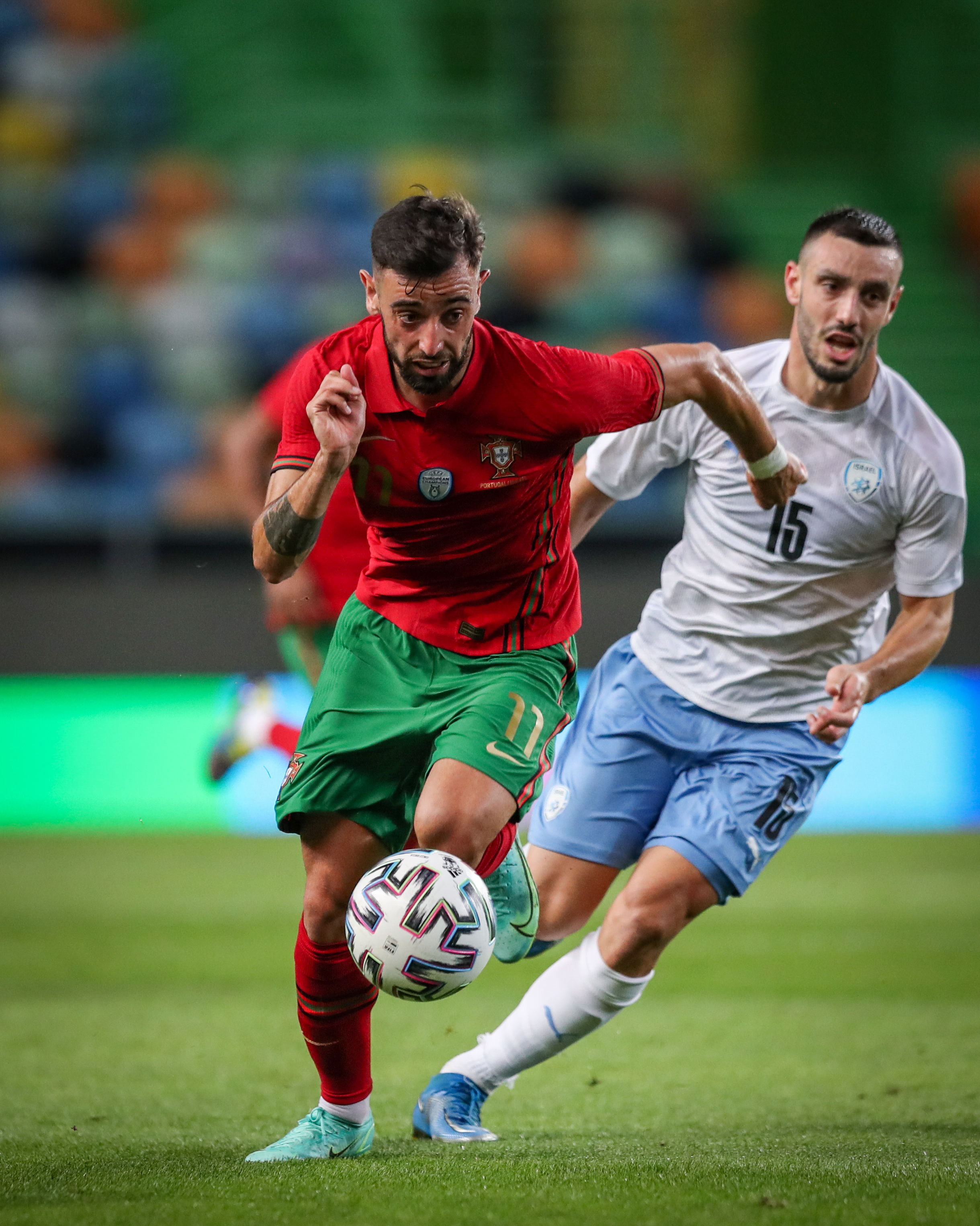 Lisbon (Portugal), 09/06/2021.- Portugal's Bruno Fernandes (L) vies for the ball with Israel's Neta Lavi during the international friendly soccer match between Portugal and Israel, in preparation for the upcoming UEFA EURO 2020 tournament, at Alvalade Stadium in Lisbon, Portugal, 09 June 2021. (Futbol, Amistoso, Lisboa) EFE/EPA/JOSE SENA GOULAO