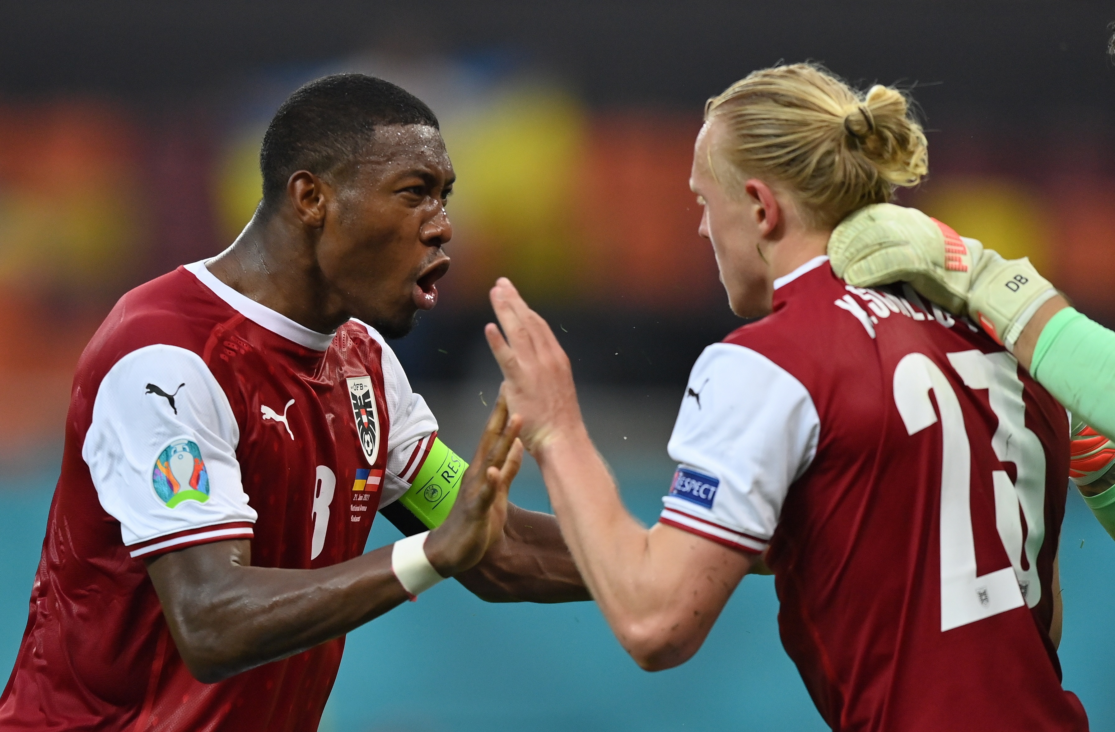 Bucharest (Romania), 21/06/2021.- David Alaba (L) of Austria and Xaver Schlager of Austria celebrate after winning the UEFA EURO 2020 group C preliminary round soccer match between Ukraine and Austria in Bucharest, Romania, 21 June 2021. (Rumanía, Ucrania, Bucarest) EFE/EPA/Justin Setterfield / POOL (RESTRICTIONS: For editorial news reporting purposes only. Images must appear as still images and must not emulate match action video footage. Photographs published in online publications shall have an interval of at least 20 seconds between the posting.)