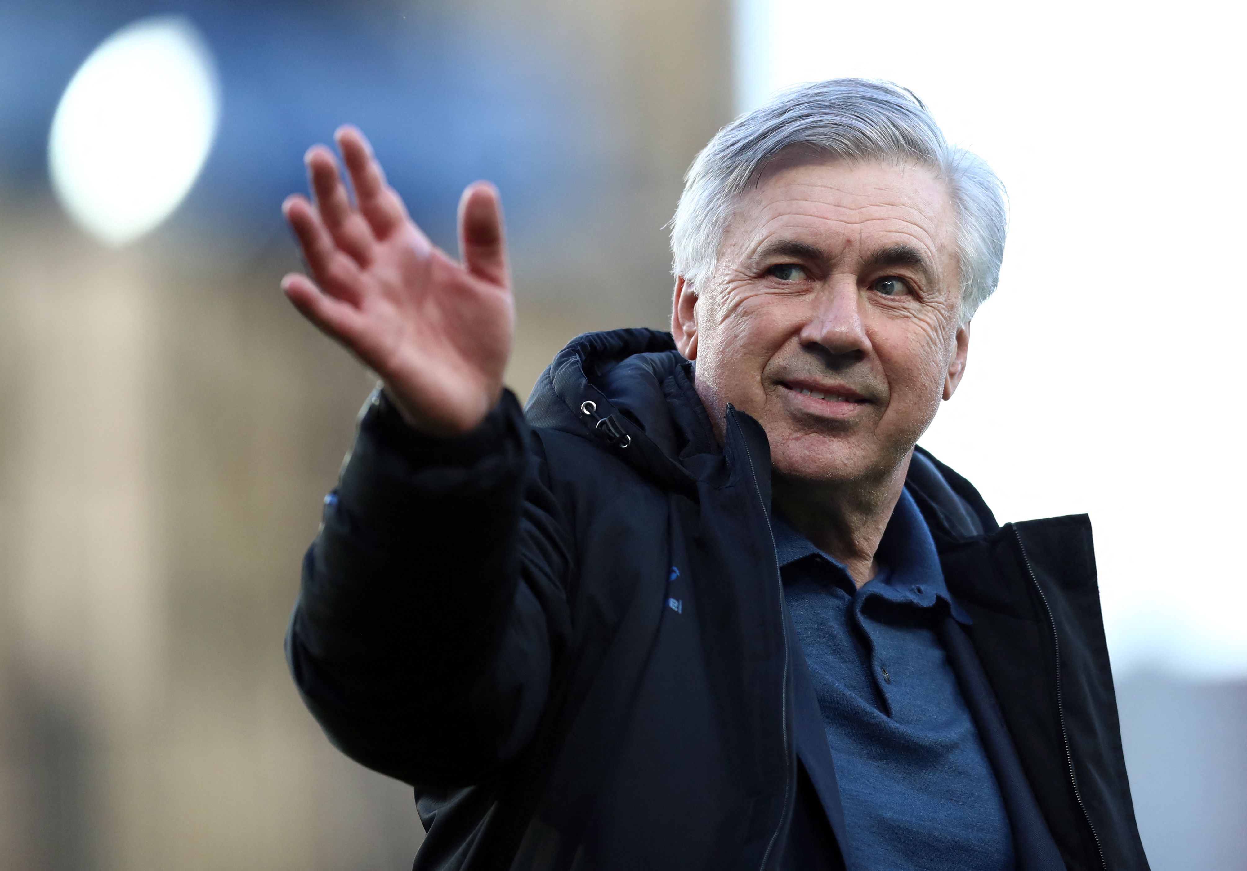 (FILES) In this file photo taken on May 19, 2021 Everton's Italian head coach Carlo Ancelotti waves after the English Premier League football match between Everton and Wolverhampton Wanderers at Goodison Park in Liverpool, north west England on May 19, 2021. - Carlo Ancelotti was named new Real Madrid coach on June 1, 2021. (Photo by Jan Kruger / POOL / AFP) / RESTRICTED TO EDITORIAL USE. No use with unauthorized audio, video, data, fixture lists, club/league logos or 'live' services. Online in-match use limited to 120 images. An additional 40 images may be used in extra time. No video emulation. Social media in-match use limited to 120 images. An additional 40 images may be used in extra time. No use in betting publications, games or single club/league/player publications. /
