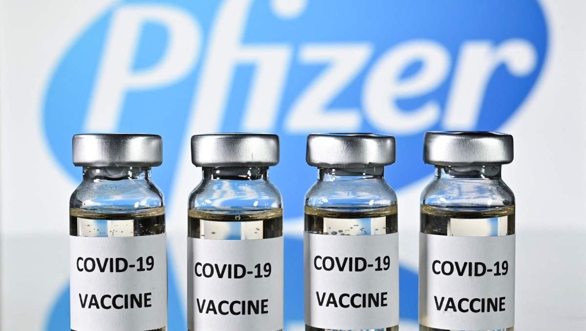 (FILES) This file photo illustration picture shows vials with Covid-19 Vaccine stickers attached, with the logo of US pharmaceutical company Pfizer, on November 17, 2020. - The administration of President Joe Biden is buying 500 million doses of the Pfizer-BioNTech Covid-19 vaccine to distribute among other countries, US media reported on June 9, 2021 citing people familiar with the matter. Biden will make the formal announcement at the G-7 meeting in Britain this week, the Washington Post and New York Times said. (Photo by JUSTIN TALLIS / AFP)