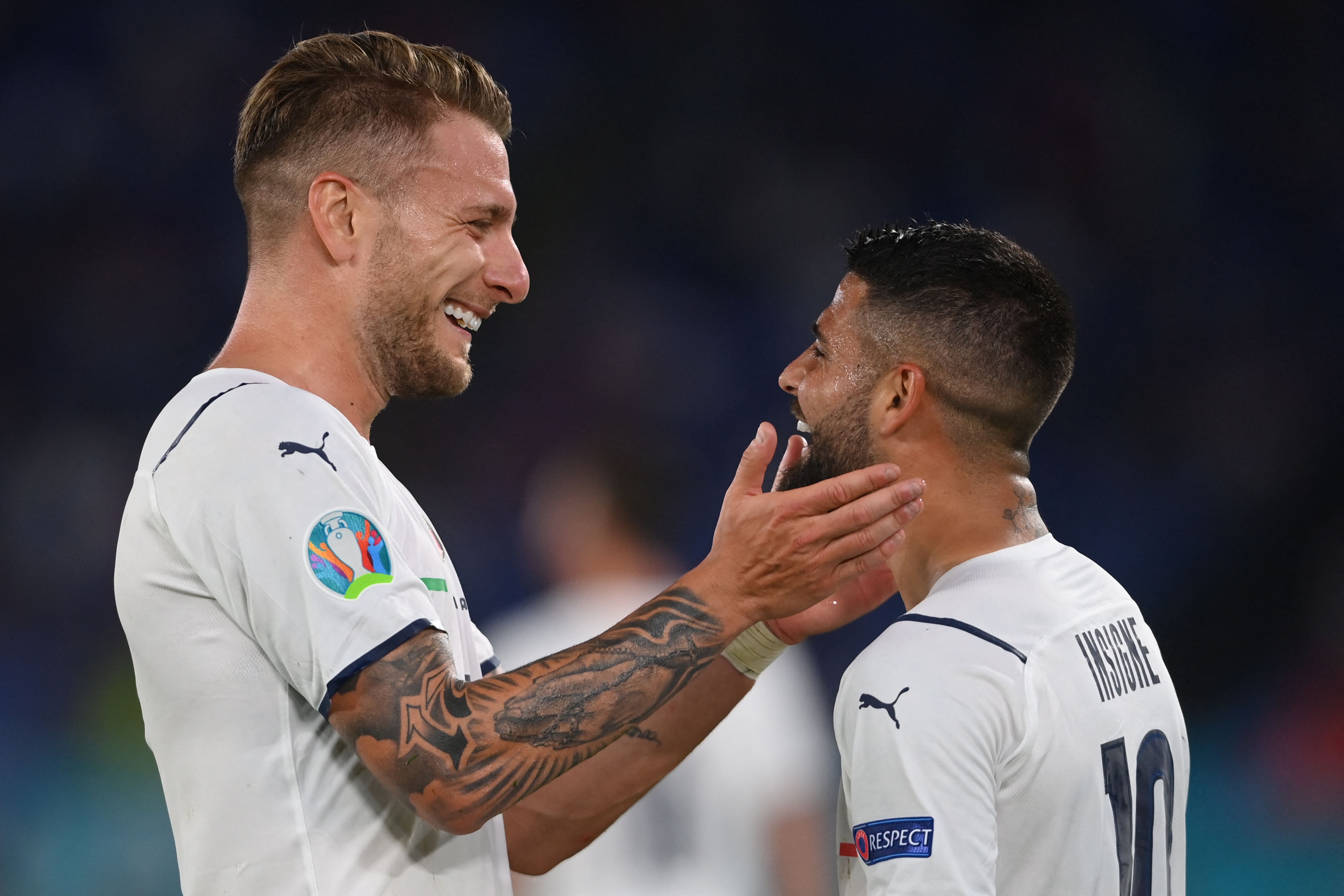 Italy's forward Lorenzo Insigne (R) celebrates with Italy's forward Ciro Immobile after scoring the team's third goal during the UEFA EURO 2020 Group A football match between Turkey and Italy at the Olympic Stadium in Rome on June 11, 2021. (Photo by Mike Hewitt / POOL / AFP)