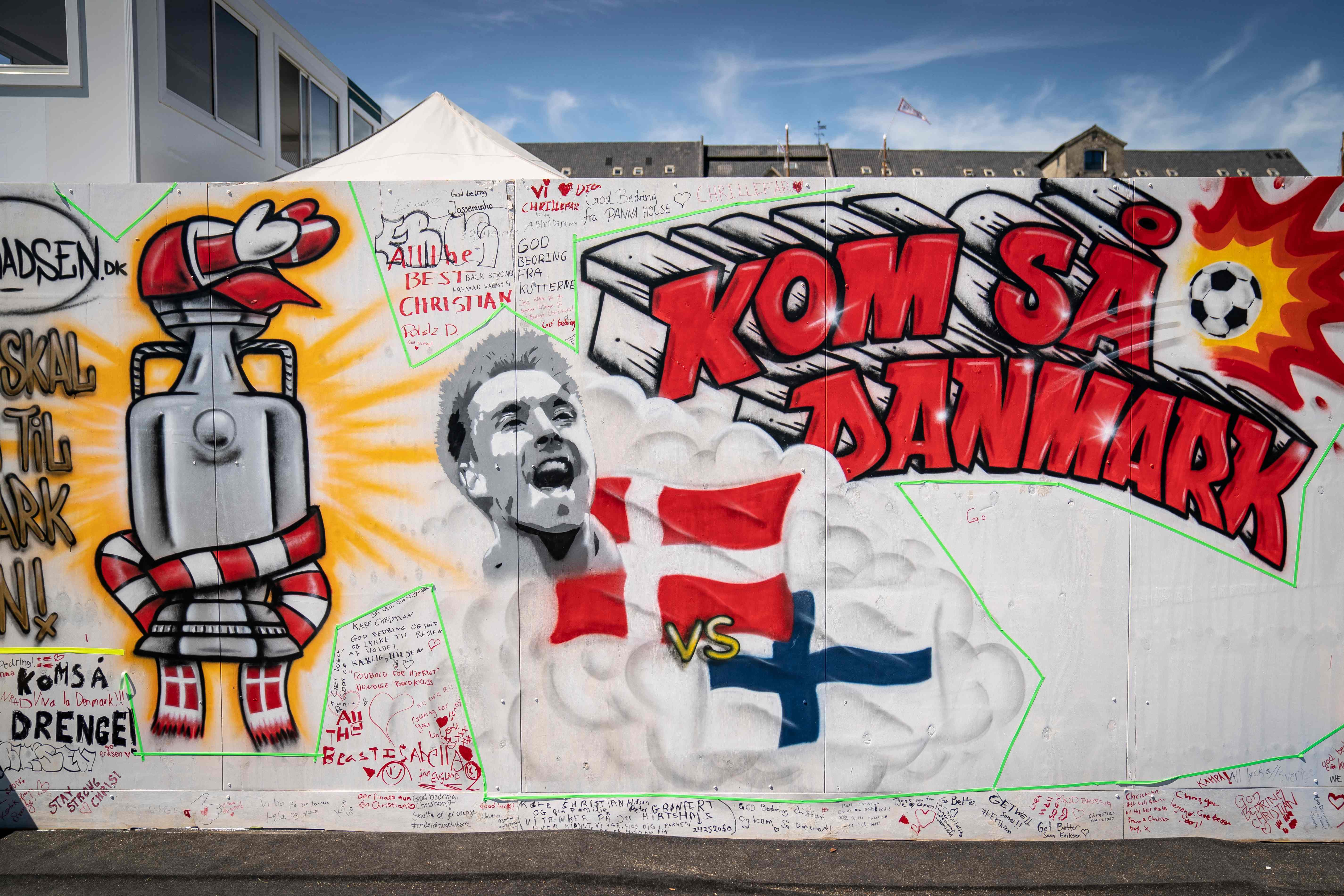 A mural with a portrait of Christian Eriksen reads 'Come on, Denmark' on the wall of the Football Village at Ofelia Beach in Copenhagen, Denmark on June 14, 2021, two days after Danish footballer Christian Eriksen collapsed during the Euro 2021 match between Denmark and Finland. (Photo by Mads Claus Rasmussen / Ritzau Scanpix / AFP) / Denmark OUT