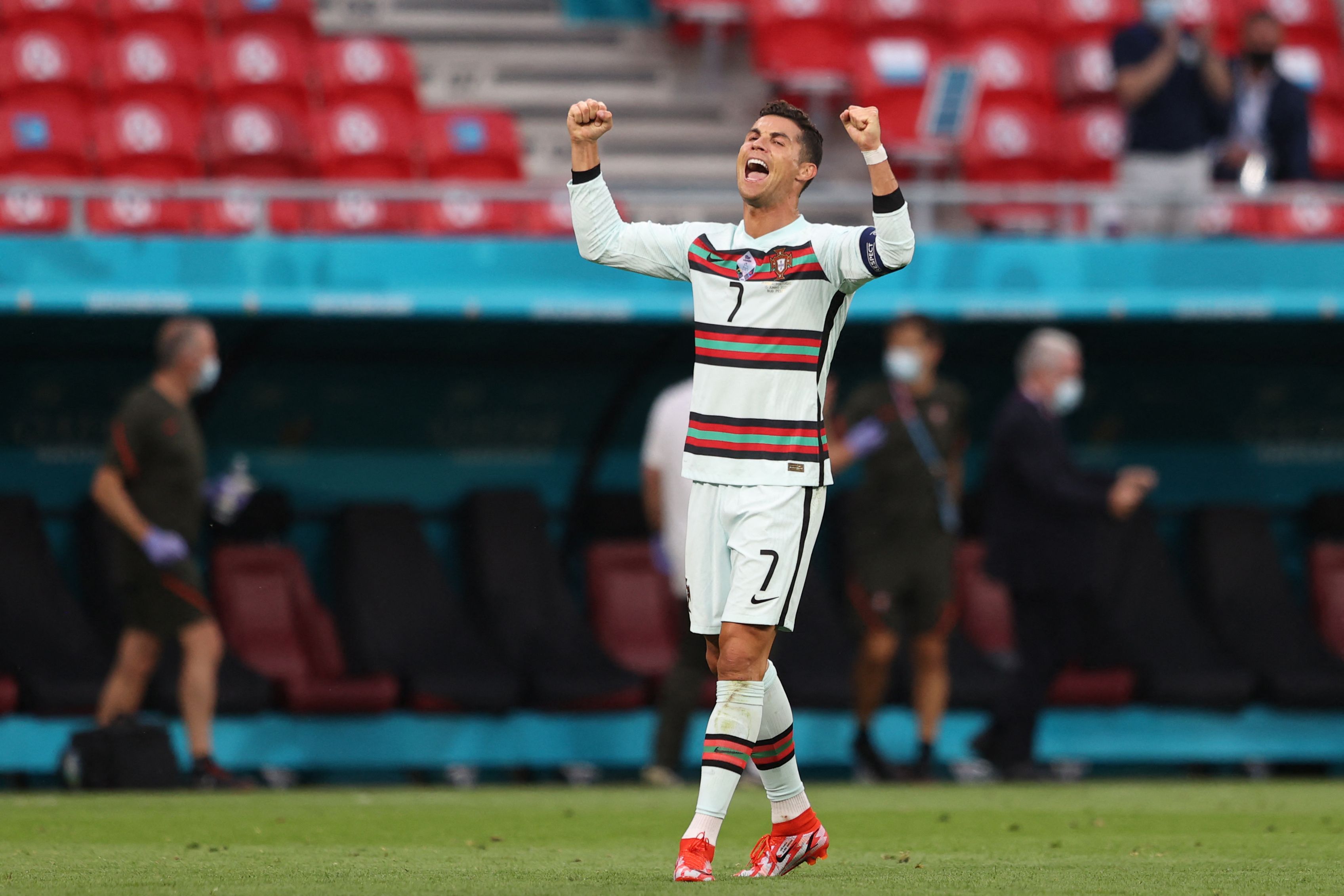 TOPSHOT - Portugal's forward Cristiano Ronaldo celebrates at the end of the UEFA EURO 2020 Group F football match between Hungary and Portugal at the Puskas Arena in Budapest on June 15, 2021. (Photo by Alex Pantling / POOL / AFP)