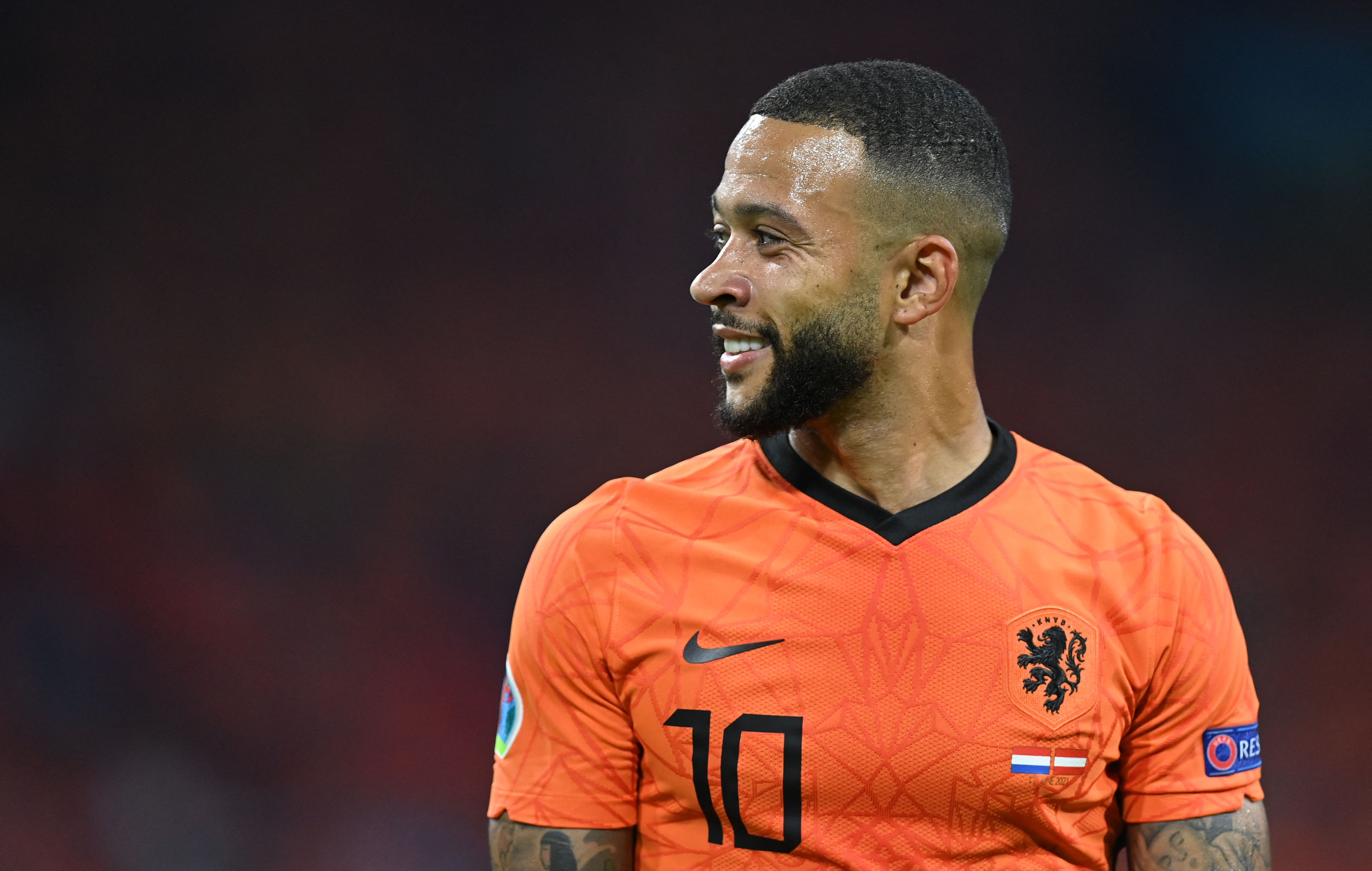Netherlands' forward Memphis Depay smiles during the UEFA EURO 2020 Group C football match between the Netherlands and Austria at the Johan Cruyff Arena in Amsterdam on June 17, 2021. (Photo by JOHN THYS / POOL / AFP)
