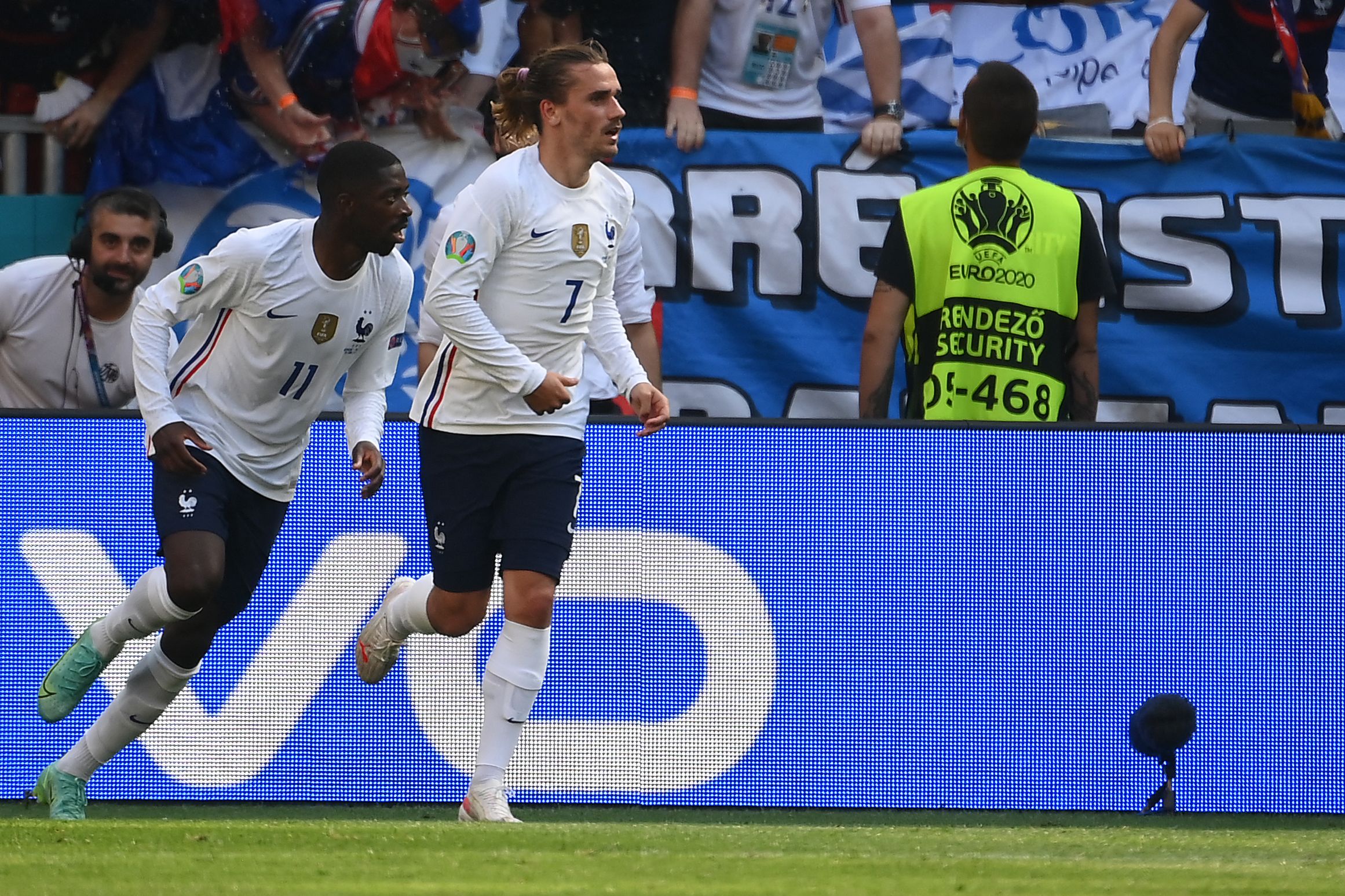 France's forward Antoine Griezmann (R) celebrates scoring his team's first goal with his teammate France's forward Ousmane Dembele during the UEFA EURO 2020 Group F football match between Hungary and France at Puskas Arena in Budapest on June 19, 2021. (Photo by FRANCK FIFE / POOL / AFP)