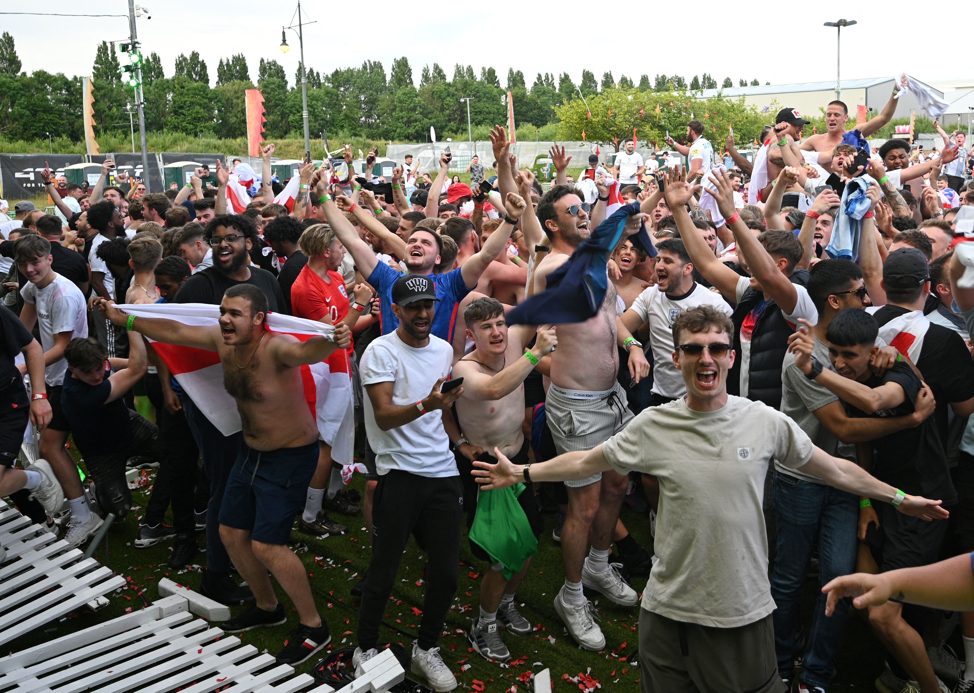 England supporters react to England's second goal, while watching their team at the 4TheFans Fan Park in Manchester, north-west England on June 29, 2021, during the UEFA EURO 2020 football match between England and Germany being played in London. (Photo by Oli SCARFF / AFP)