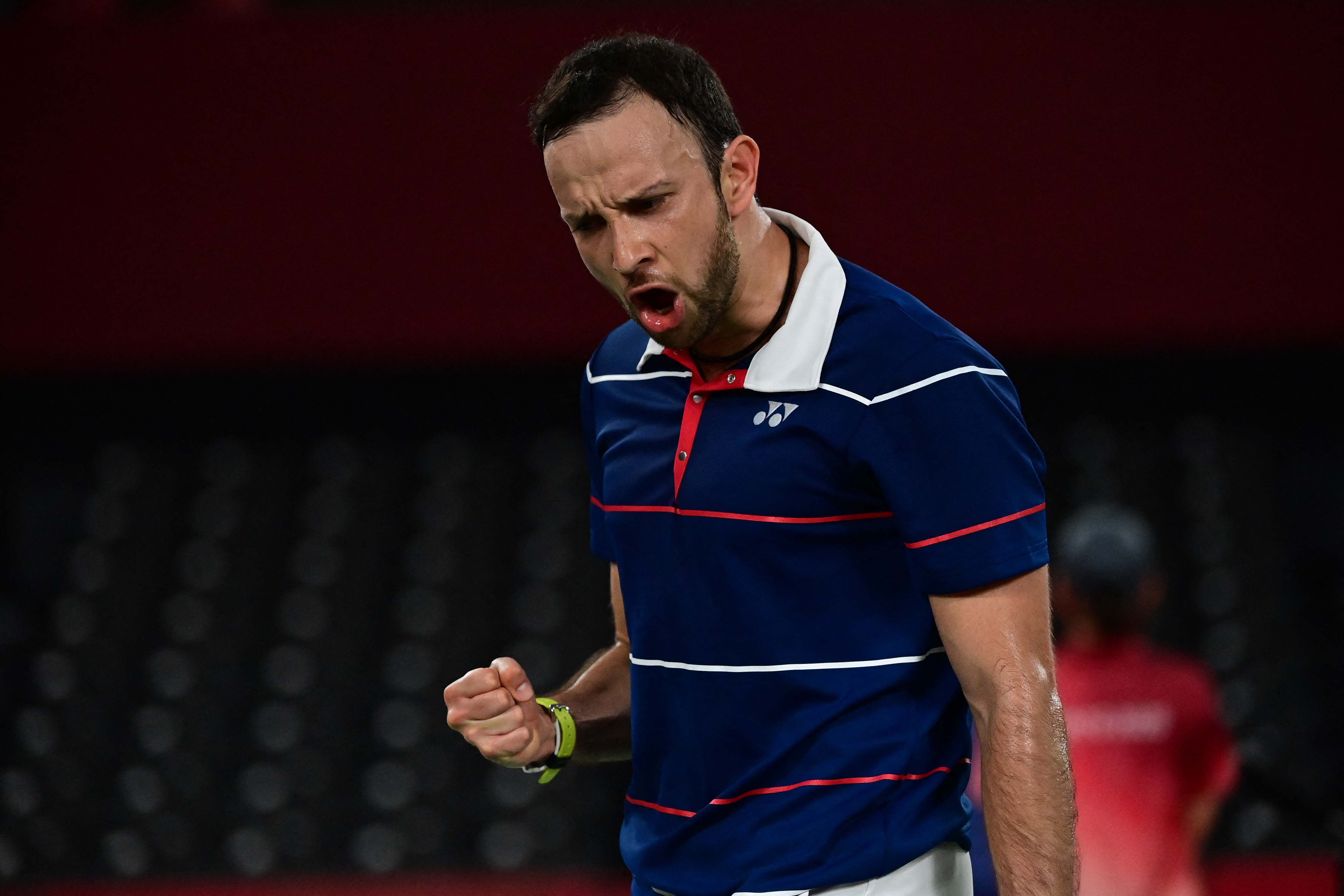 Guatemala's Kevin Cordon reacts between points with Hong Kong's Angus Ng Ka Long in their men's singles badminton group stage match during the Tokyo 2020 Olympic Games at the Musashino Forest Sports Plaza in Tokyo on July 28, 2021. (Photo by Pedro PARDO / AFP)