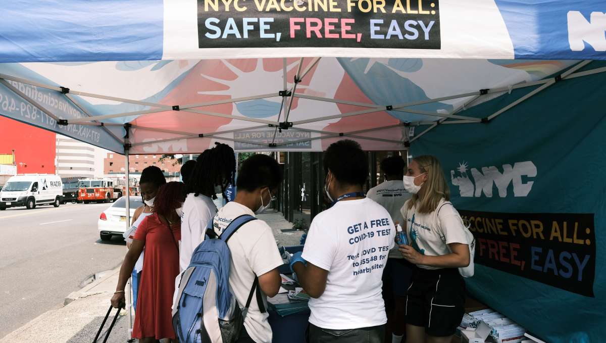 NEW YORK CITY - JULY 26: A city-operated mobile pharmacy advertises the COVID-19 vaccine in a neighborhood near Brighton Beach on July 26, 2021 in the Brooklyn borough of New York City. Due to the rapidly spreading Delta variant, New York City Mayor Bill de Blasio has announced that the city will require all city workers to be vaccinated or tested weekly for COVID-19. Spencer Platt/Getty Images/AFP == FOR NEWSPAPERS, INTERNET, TELCOS & TELEVISION USE ONLY ==