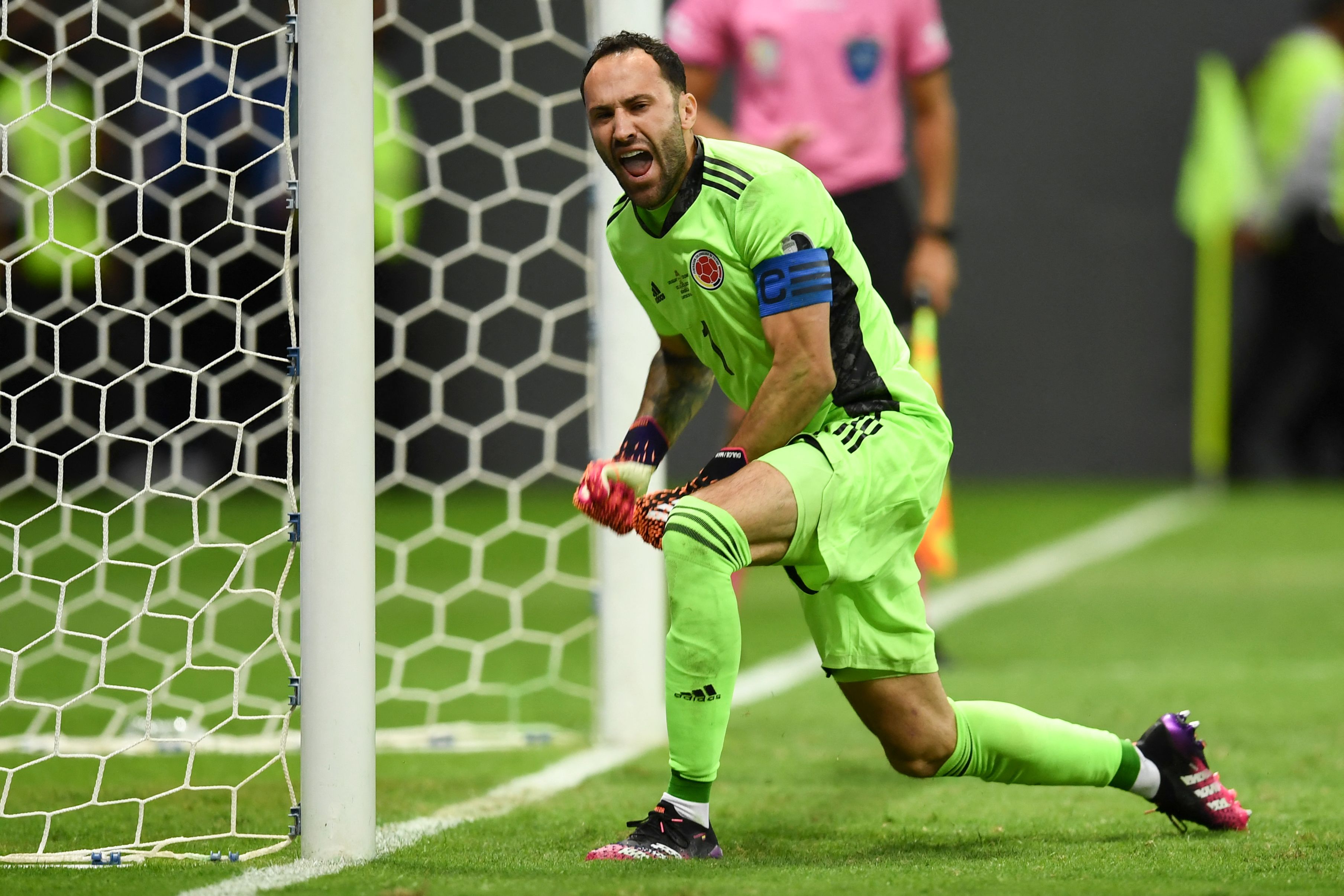 Colombia's goalkeeper David Ospina celebrates after stopping the penalty shot by Uruguay's Jose Maria Gimenez during their Conmebol 2021 Copa America football tournament quarter-final match at the Mane Garrincha Stadium in Brasilia, Brazil, on July 3, 2021. (Photo by EVARISTO SA / AFP)