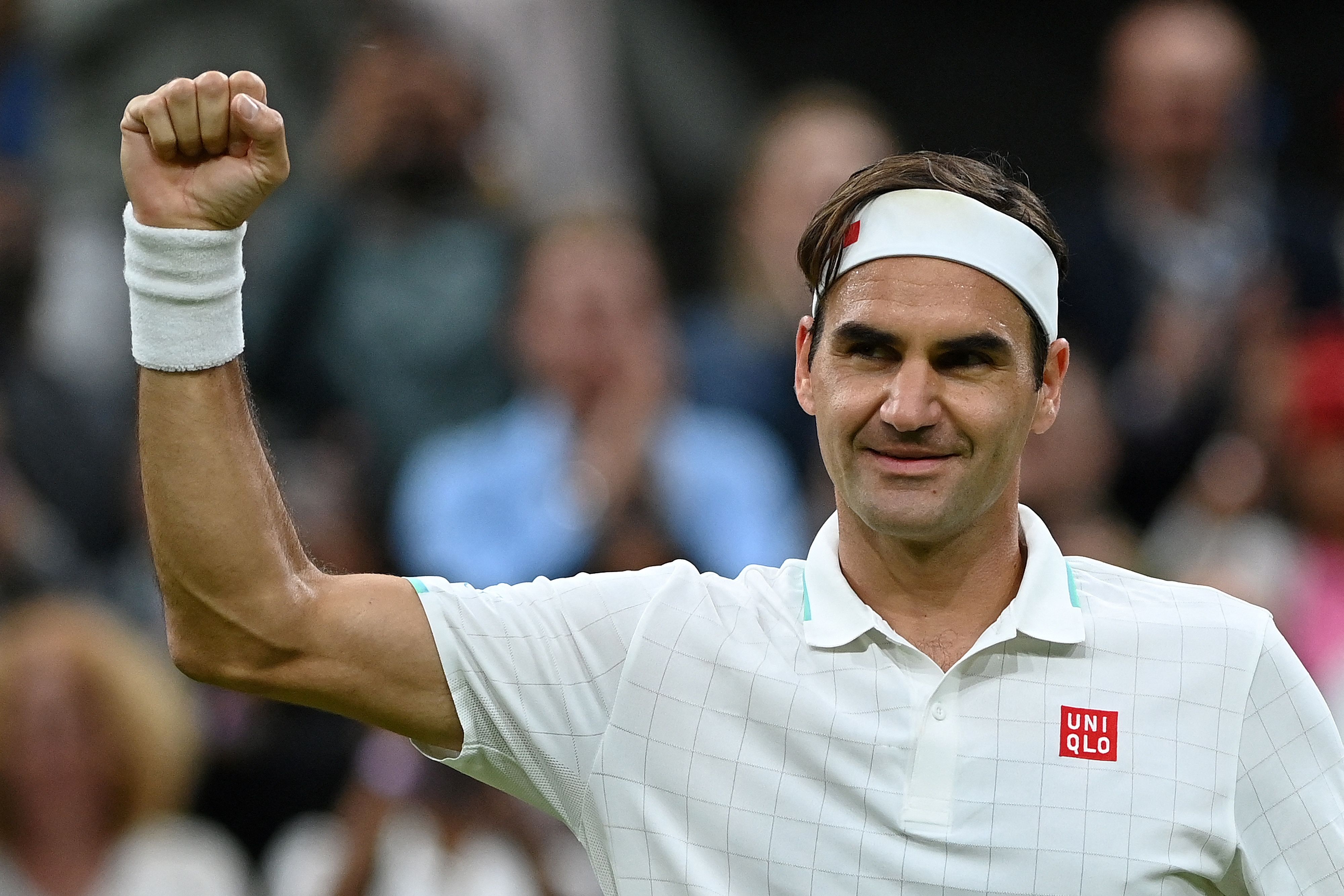 Switzerland's Roger Federer celebrates winning against Italy's Lorenzo Sonego during their men's singles fourth round match on the seventh day of the 2021 Wimbledon Championships at The All England Tennis Club in Wimbledon, southwest London, on July 5, 2021. (Photo by Glyn KIRK / AFP) / RESTRICTED TO EDITORIAL USE