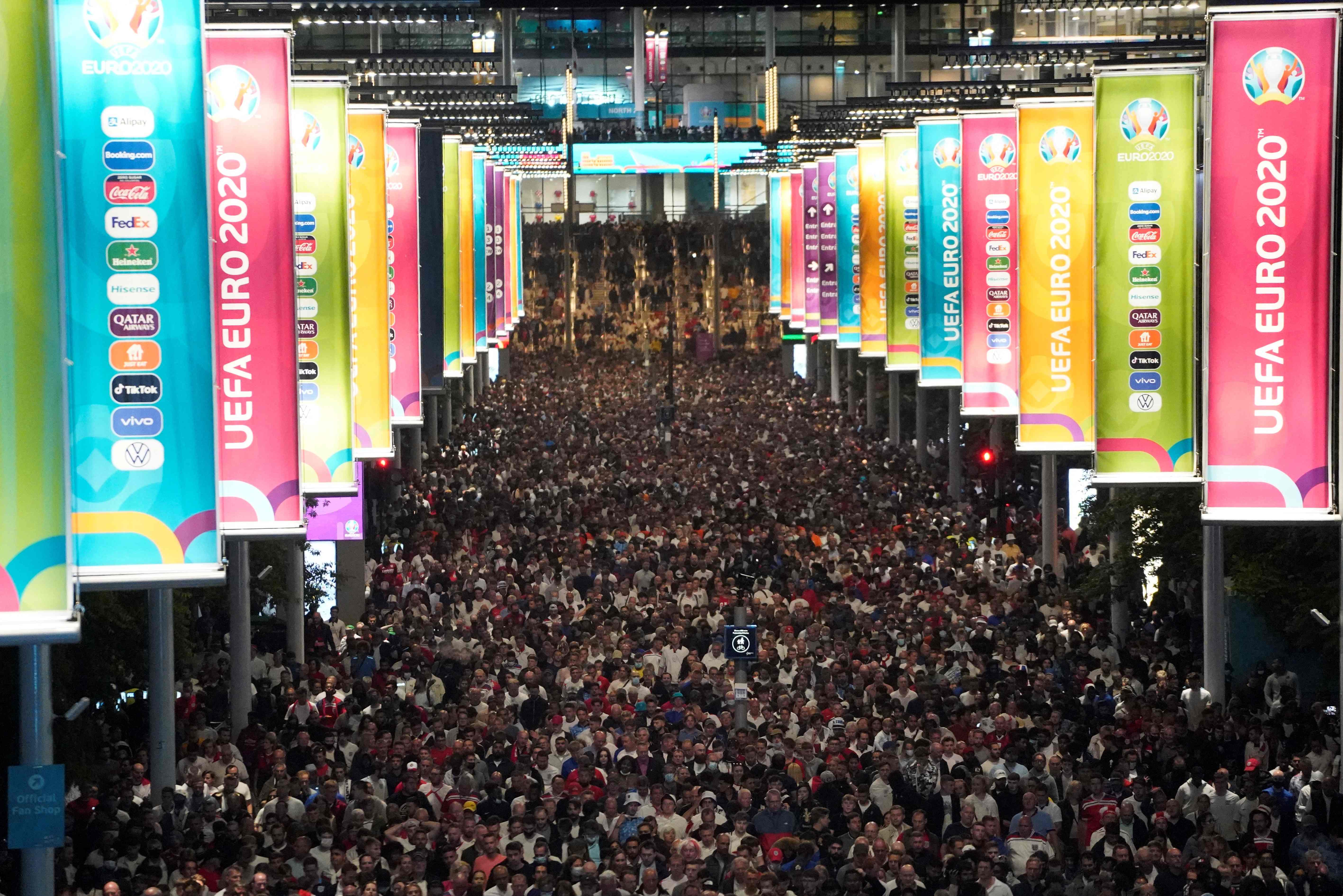 TOPSHOT - Crowds leave Wembley Stadium after Italy wins the UEFA EURO 2020 final football match between England and Italy in northwest London on July 11, 2021. (Photo by Niklas HALLE'N / AFP)