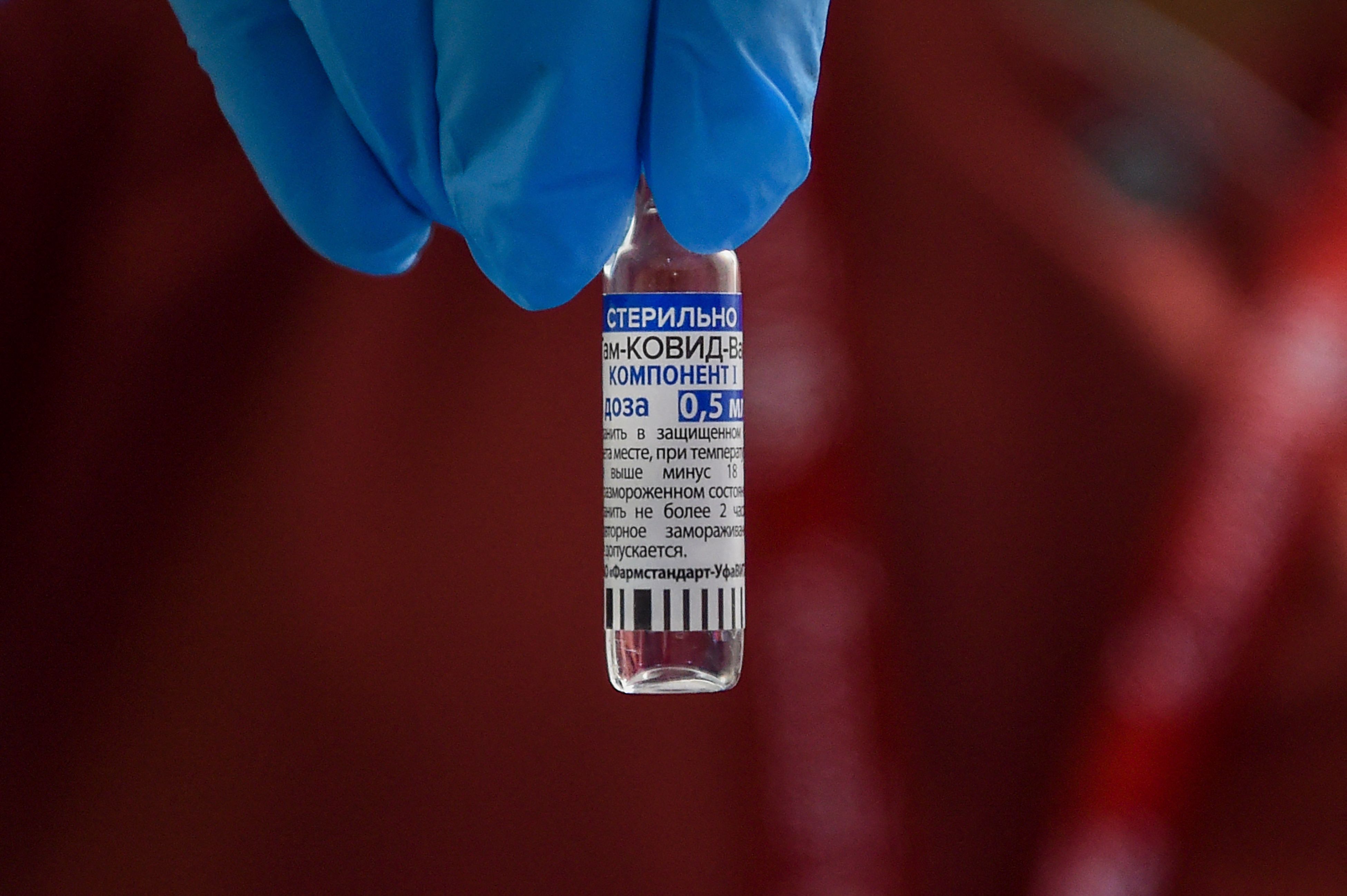 A health worker shows a vial of the Russia's Sputnik V Covid-19 coronavirus vaccine at a vaccination facility in Mumbai on July 13, 2021. (Photo by Punit PARANJPE / AFP)