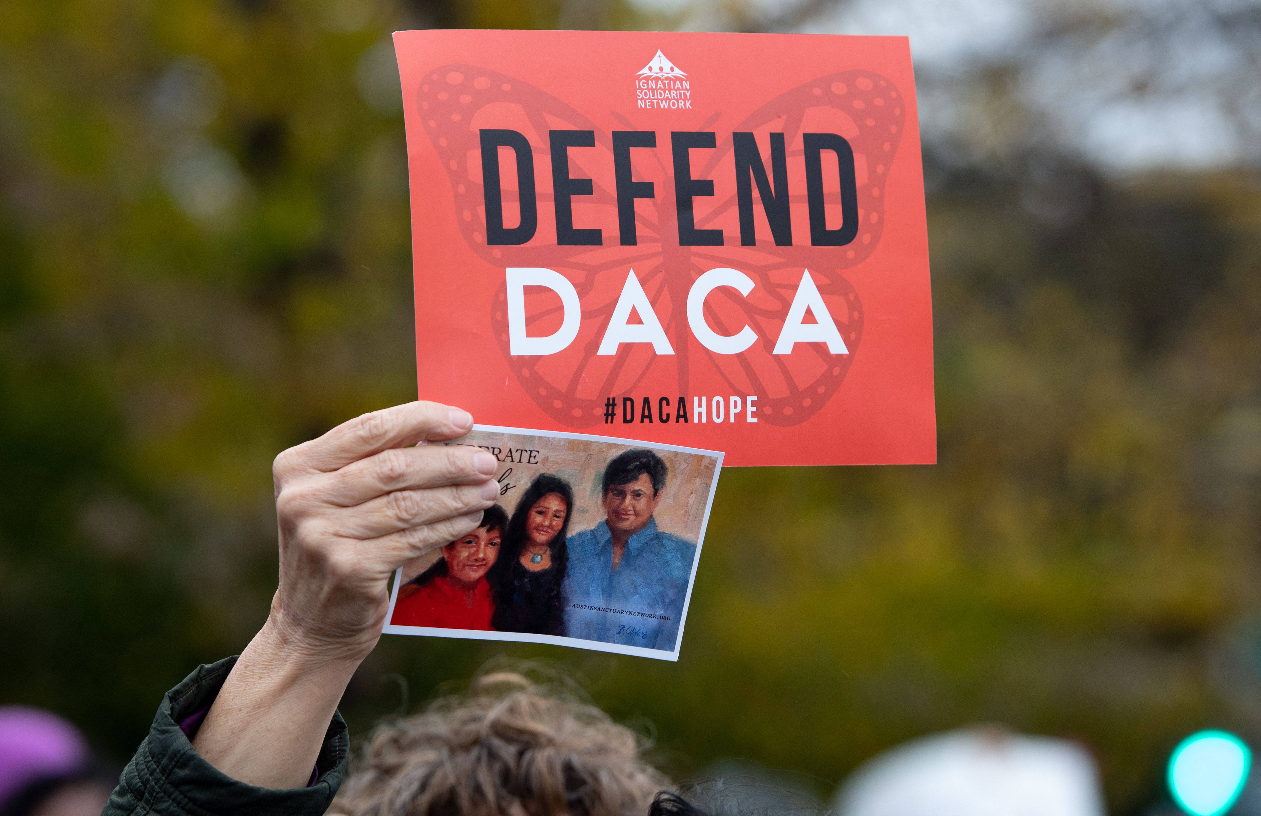 (FILES) In this file photo taken on November 12, 2019, immigration rights activists hold a rally in front of the US Supreme Court in Washington, DC, as the Court hears arguments about ending the Deferred Action for Childhood Arrivals (DACA) program. - A US federal judge on July 16, 2021, dealt a fresh blow to an immigration program protecting undocumented migrants brought to the country as children, ruling it unlawful and blocking the enrollment of new applicants. In his ruling, Judge Andrew Hanen of the US District Court in Houston said former President Barack Obama exceeded his authority when he instituted DACA by executive order. (Photo by SAUL LOEB / AFP)