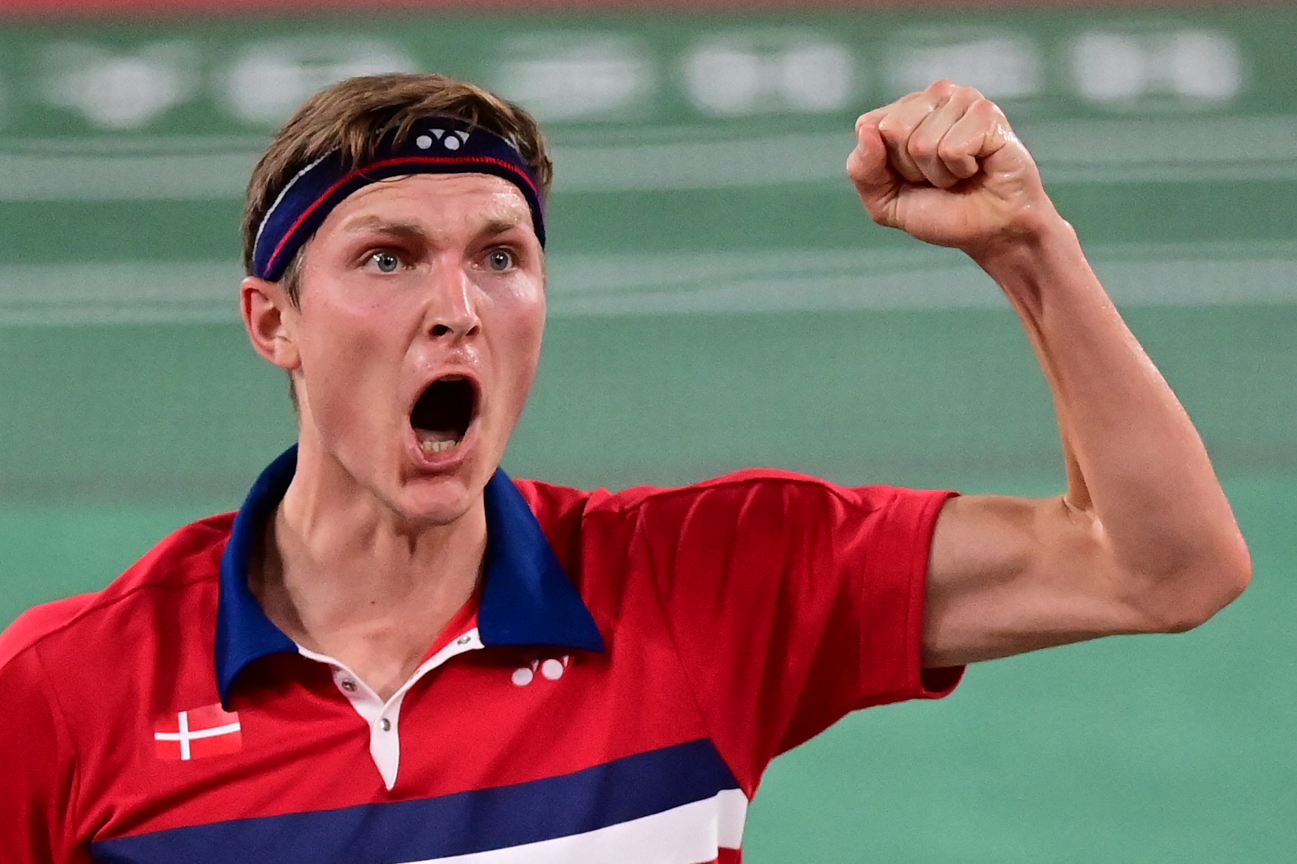 Denmark's Viktor Axelsen celebrates after beating China's Shi Yuqi in their men's singles badminton quarter final match during the Tokyo 2020 Olympic Games at the Musashino Forest Sports Plaza in Tokyo on July 31, 2021. (Photo by Pedro PARDO / AFP)